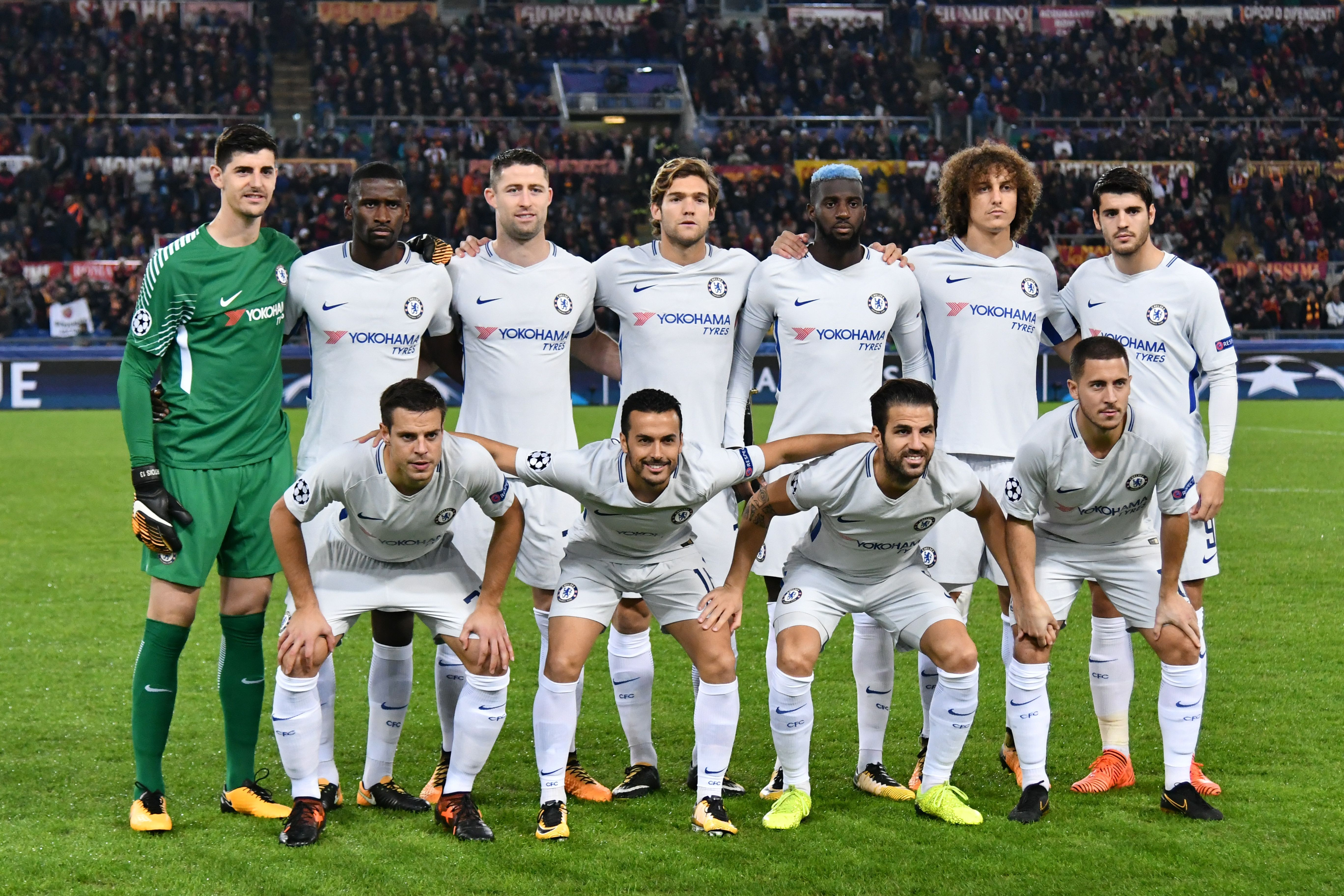 Chelsea's team players (from top left) Chelsea's Belgian goalkeeper Thibaut Courtois, Chelsea's German defender Antonio Rudiger, Chelsea's English defender Gary Cahill, Chelsea's Spanish defender Marcos Alonso, Chelsea's French midfielder Tiemoue Bakayoko, Chelsea's Brazilian defender David Luiz, Chelsea's Spanish striker Alvaro Morata, Chelsea's Spanish defender Cesar Azpilicueta, Chelsea's Spanish midfielder Pedro, Chelsea's Spanish midfielder Cesc Fabregas and Chelsea's Belgian midfielder Eden Hazard pose before the UEFA Champions League football match AS Roma vs Chelsea on October 31, 2017 at the Olympic Stadium in Rome.  / AFP PHOTO / Alberto PIZZOLI        (Photo credit should read ALBERTO PIZZOLI/AFP/Getty Images)