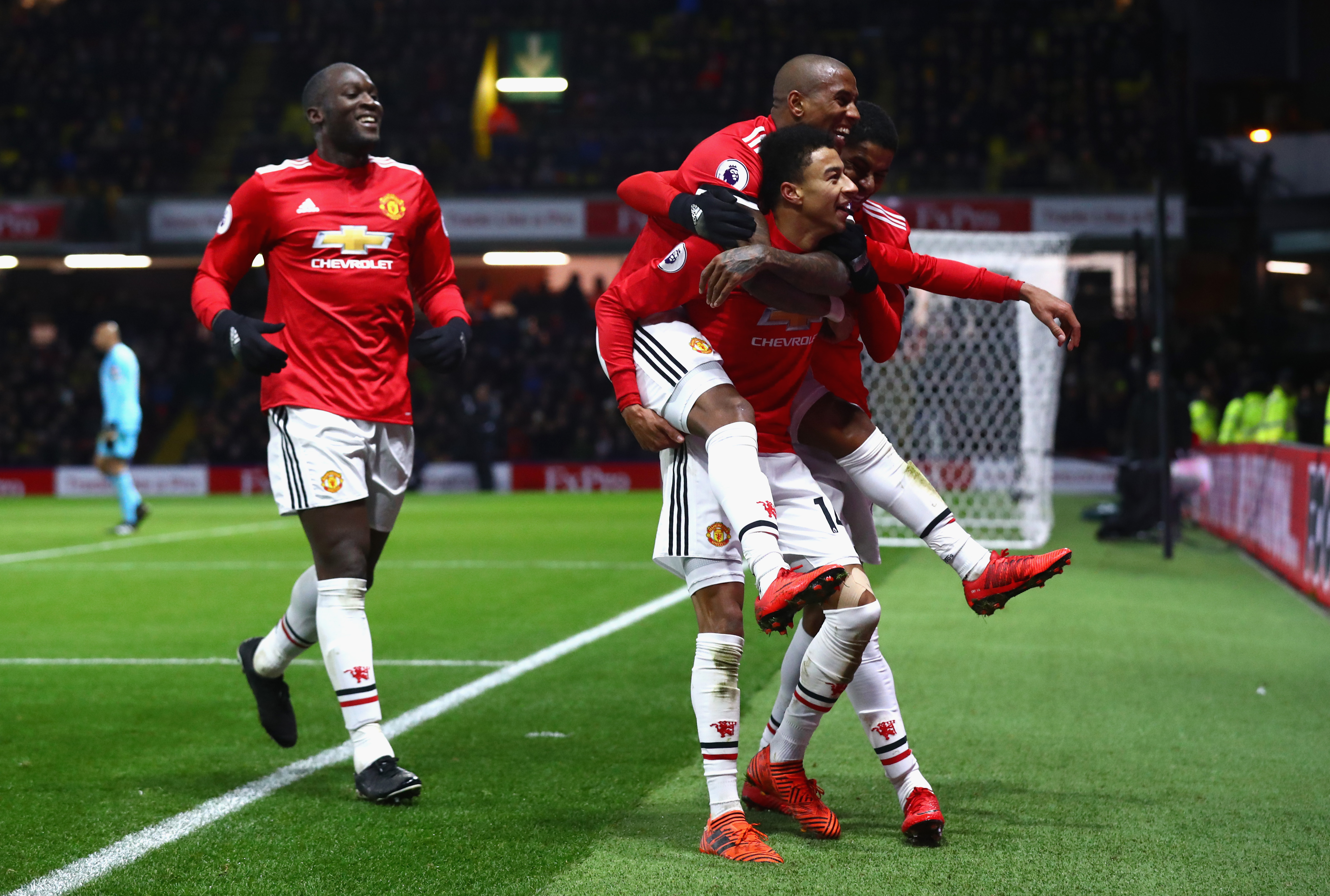 WATFORD, ENGLAND - NOVEMBER 28:  Jesse Lingard of Manchester United celebrates as he scores their fourth goal with Ashley Young and Romelu Lukaku during the Premier League match between Watford and Manchester United at Vicarage Road on November 28, 2017 in Watford, England.  (Photo by Clive Rose/Getty Images)