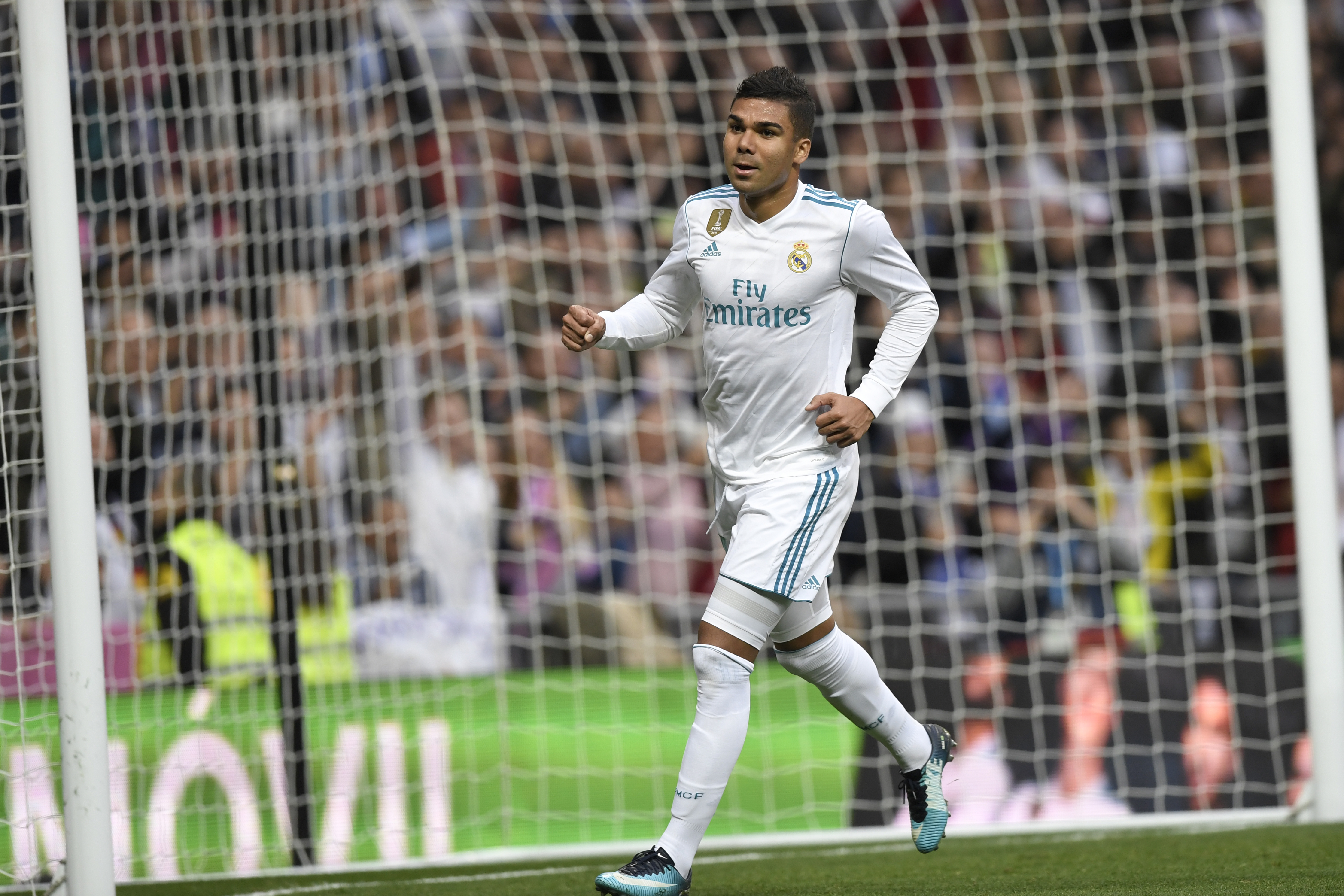 Real Madrid's Brazilian midfielder Casemiro celebrates after scoring during the Spanish league football match Real Madrid CF against Malaga CF on 25, November 2017 at the Santiago Bernabeu stadium in Madrid. / AFP PHOTO / GABRIEL BOUYS        (Photo credit should read GABRIEL BOUYS/AFP/Getty Images)