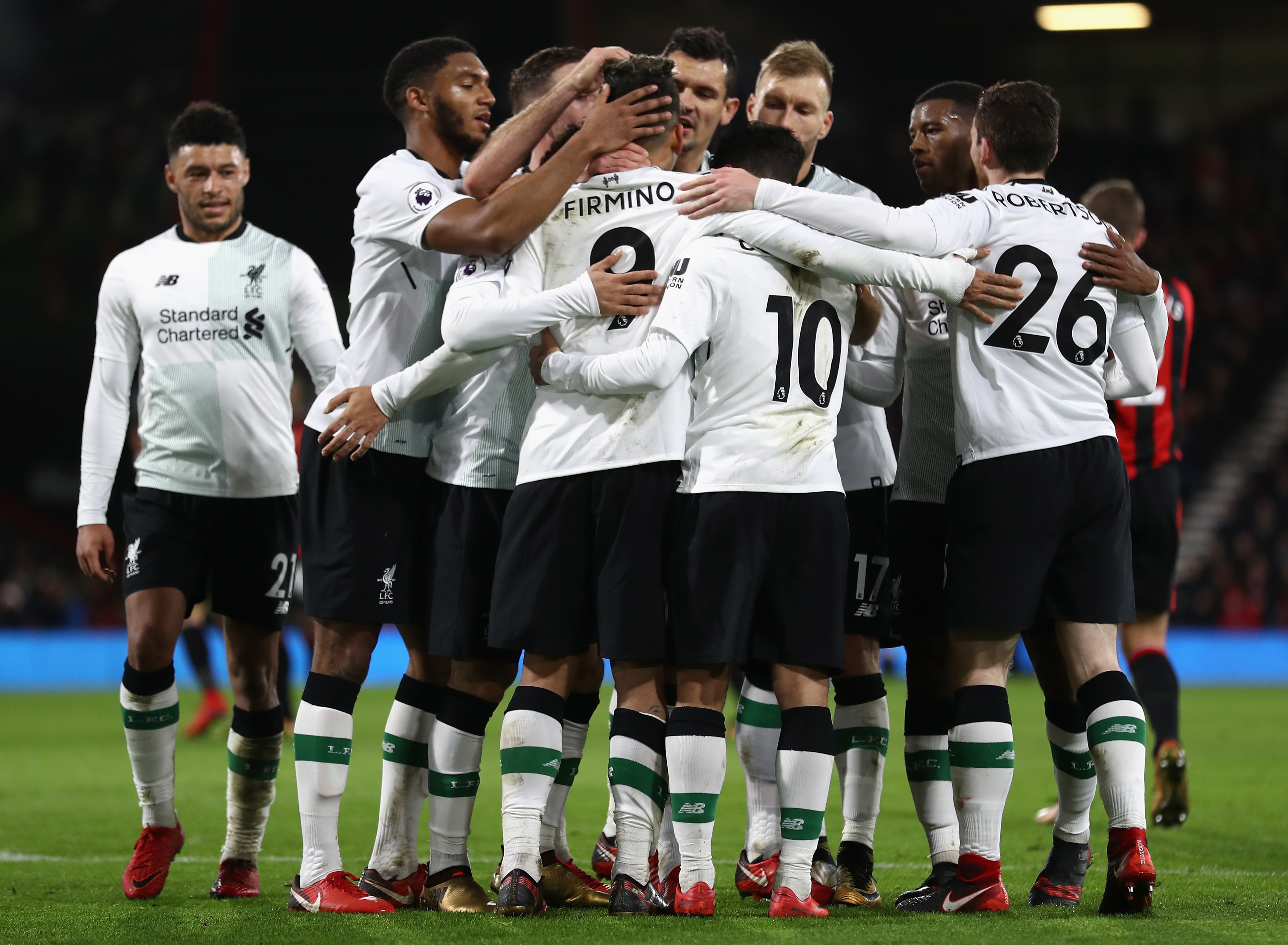 BOURNEMOUTH, ENGLAND - DECEMBER 17:  Roberto Firmino of Liverpool celebrates with his teammates after scoring his sides fourth goal during the Premier League match between AFC Bournemouth and Liverpool at Vitality Stadium on December 17, 2017 in Bournemouth, England.  (Photo by Bryn Lennon/Getty Images)