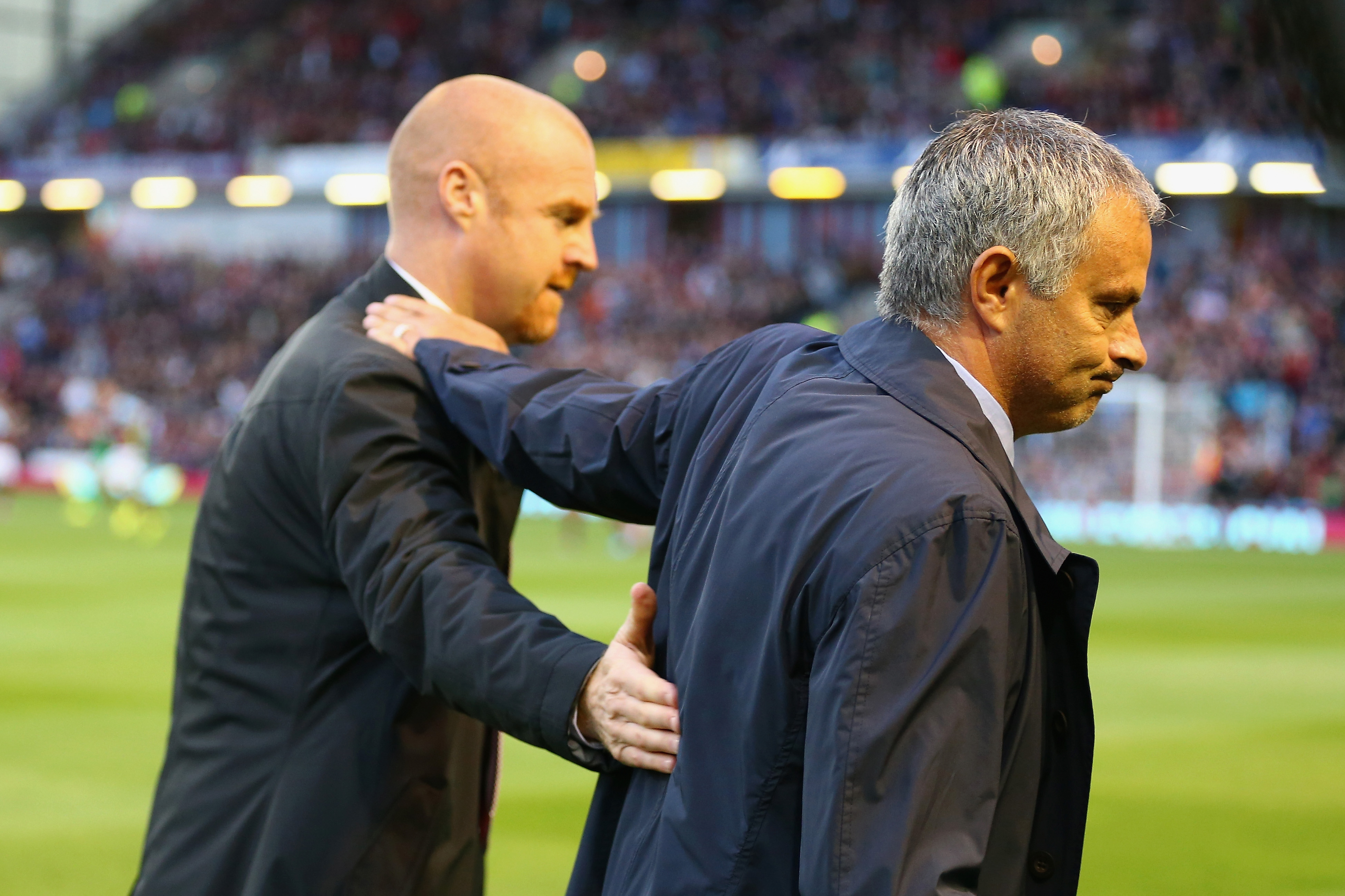 BURNLEY, ENGLAND - AUGUST 18:  Manager Sean Dyche of Burnley greets Manager Jose Mourinho of Chelsea during the Barclays Premier League match between Burnley and Chelsea at Turf Moor on August 18, 2014 in Burnley, England.  (Photo by Clive Brunskill/Getty Images)