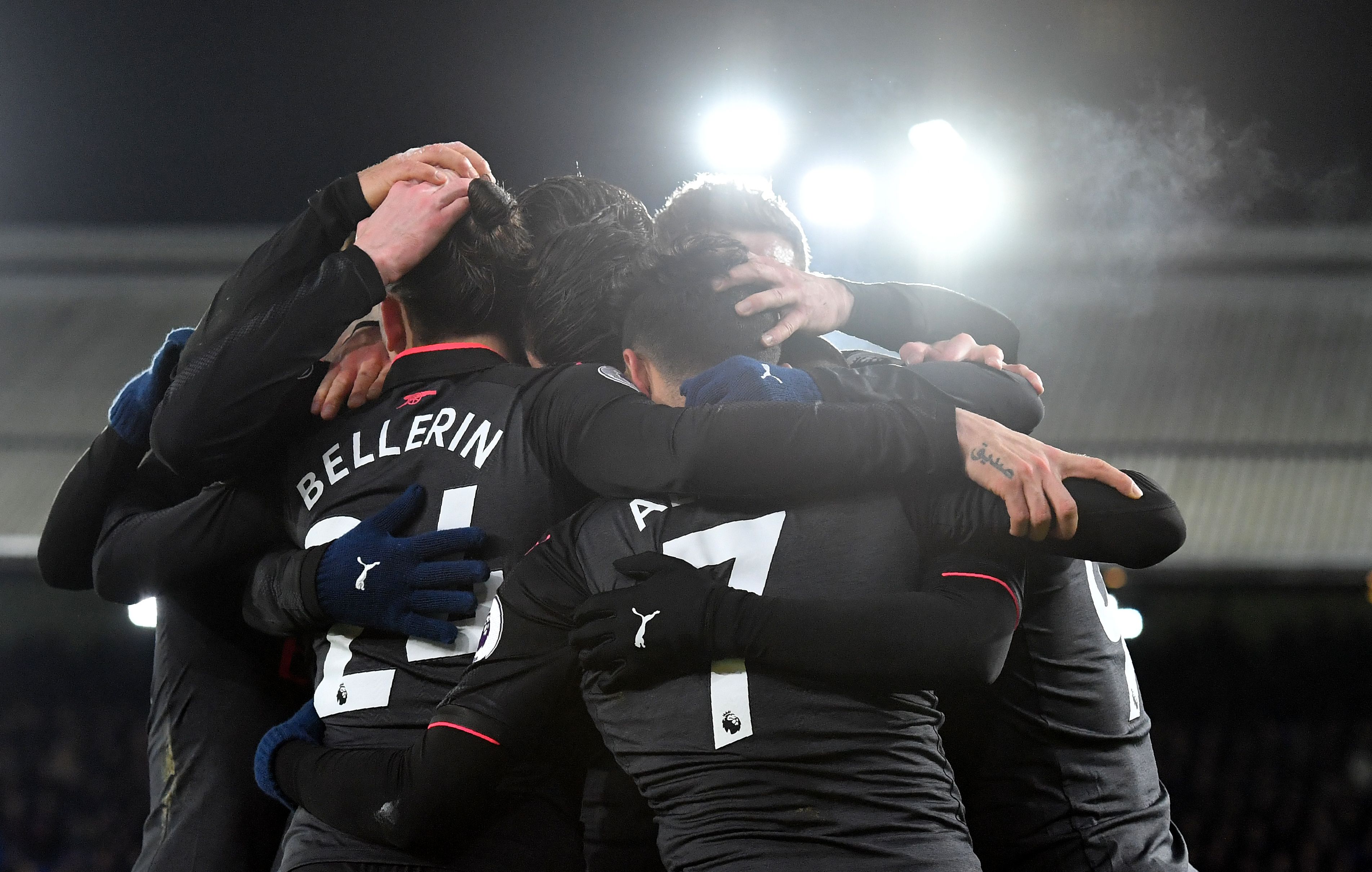 Arsenal's Chilean striker Alexis Sanchez celebrates after scoring their third goal with teammates during the English Premier League football match between Crystal Palace and Arsenal at Selhurst Park in south London on December 28, 2017. / AFP PHOTO / Ben STANSALL / RESTRICTED TO EDITORIAL USE. No use with unauthorized audio, video, data, fixture lists, club/league logos or 'live' services. Online in-match use limited to 75 images, no video emulation. No use in betting, games or single club/league/player publications.  /         (Photo credit should read BEN STANSALL/AFP/Getty Images)