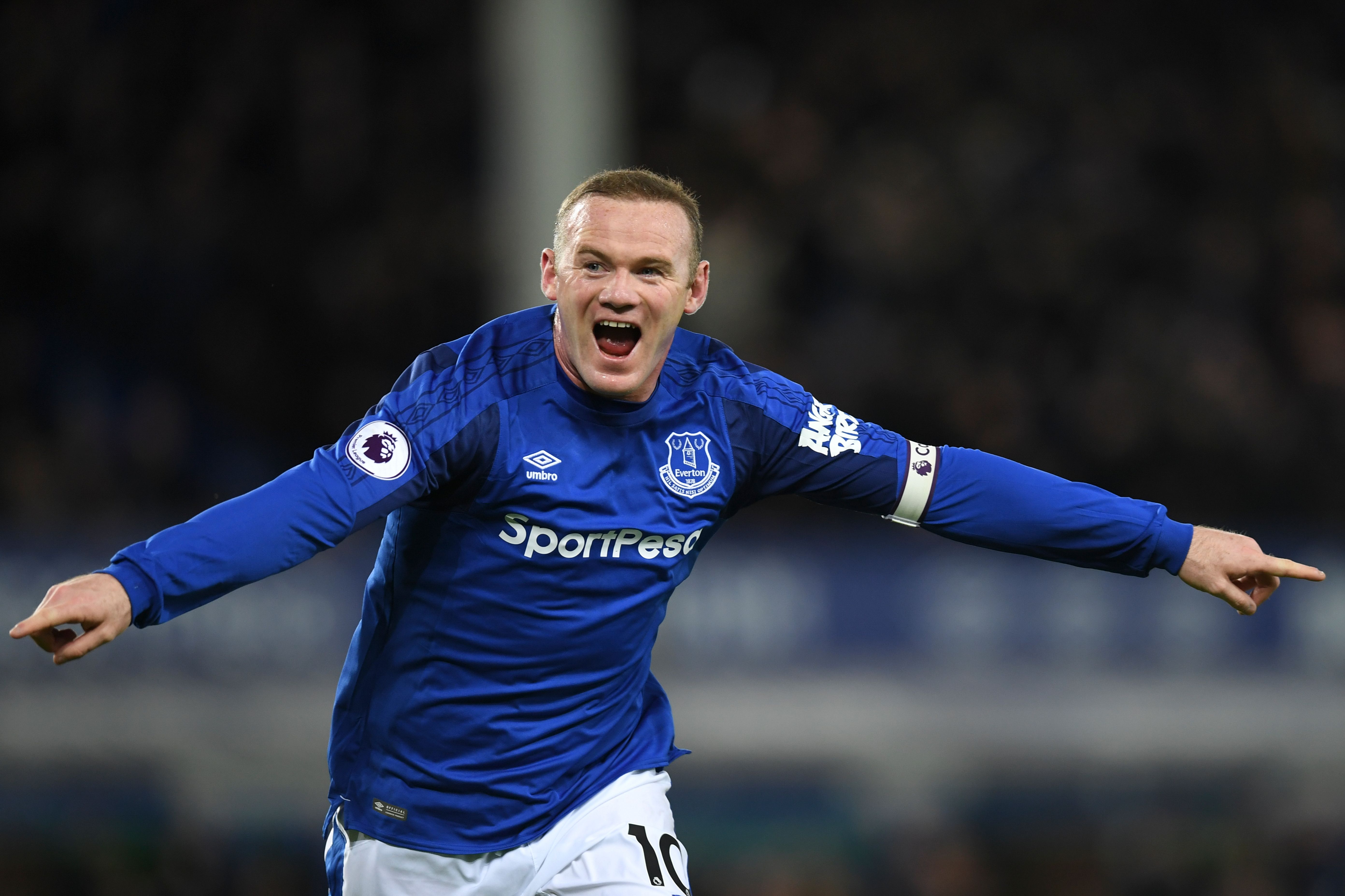 Everton's English striker Wayne Rooney celebrates scoring their second goal during the English Premier League football match between Everton and West Ham United at Goodison Park in Liverpool, north west England on November 29, 2017. / AFP PHOTO / Paul ELLIS / RESTRICTED TO EDITORIAL USE. No use with unauthorized audio, video, data, fixture lists, club/league logos or 'live' services. Online in-match use limited to 75 images, no video emulation. No use in betting, games or single club/league/player publications.  /         (Photo credit should read PAUL ELLIS/AFP/Getty Images)