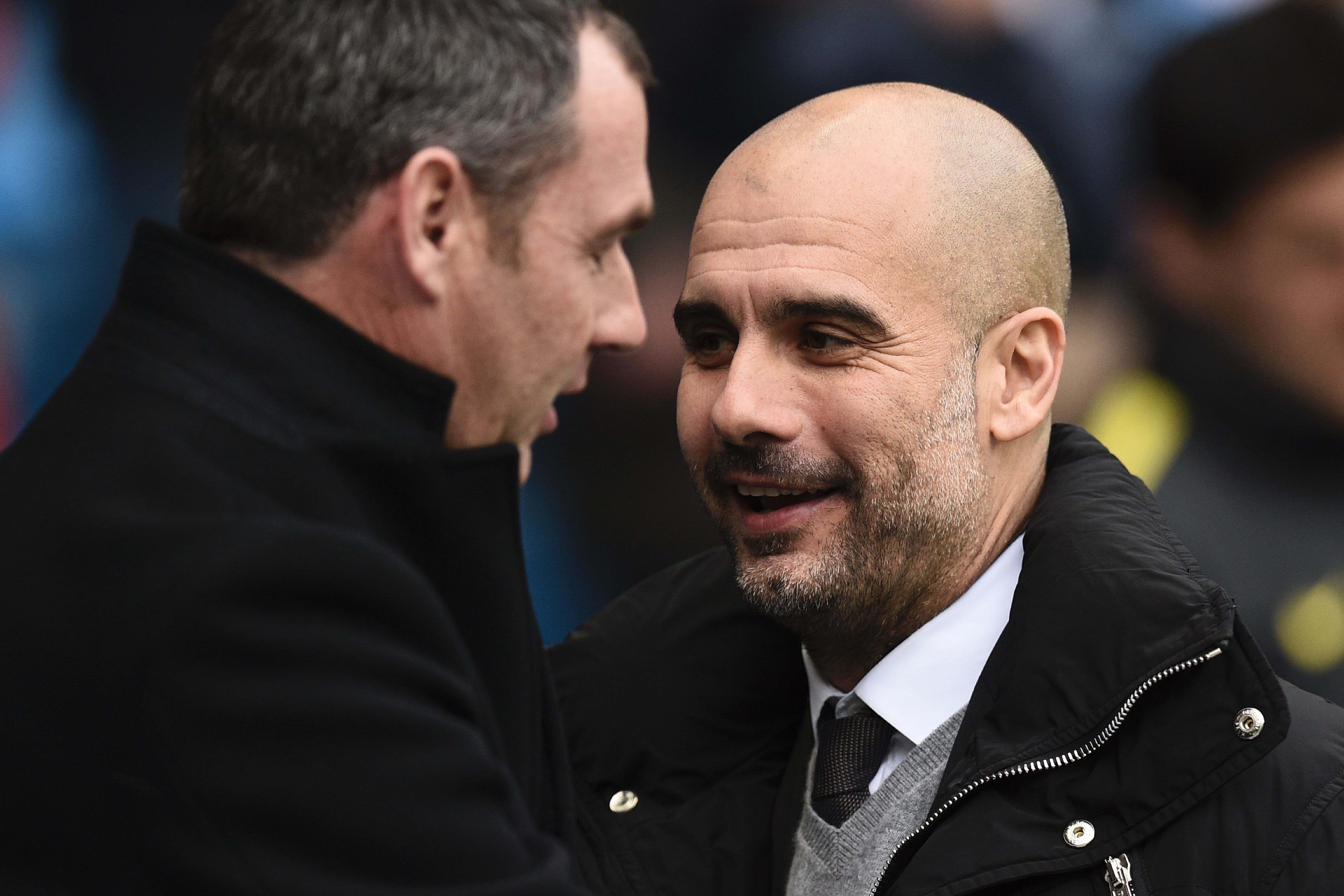 Manchester City's Spanish manager Pep Guardiola greets Swansea City's English head coach Paul Clement (L) ahead of the English Premier League football match between Manchester City and Swansea City at the Etihad Stadium in Manchester, north west England, on February 5, 2017. / AFP / Oli SCARFF / RESTRICTED TO EDITORIAL USE. No use with unauthorized audio, video, data, fixture lists, club/league logos or 'live' services. Online in-match use limited to 75 images, no video emulation. No use in betting, games or single club/league/player publications.  /         (Photo credit should read OLI SCARFF/AFP/Getty Images)
