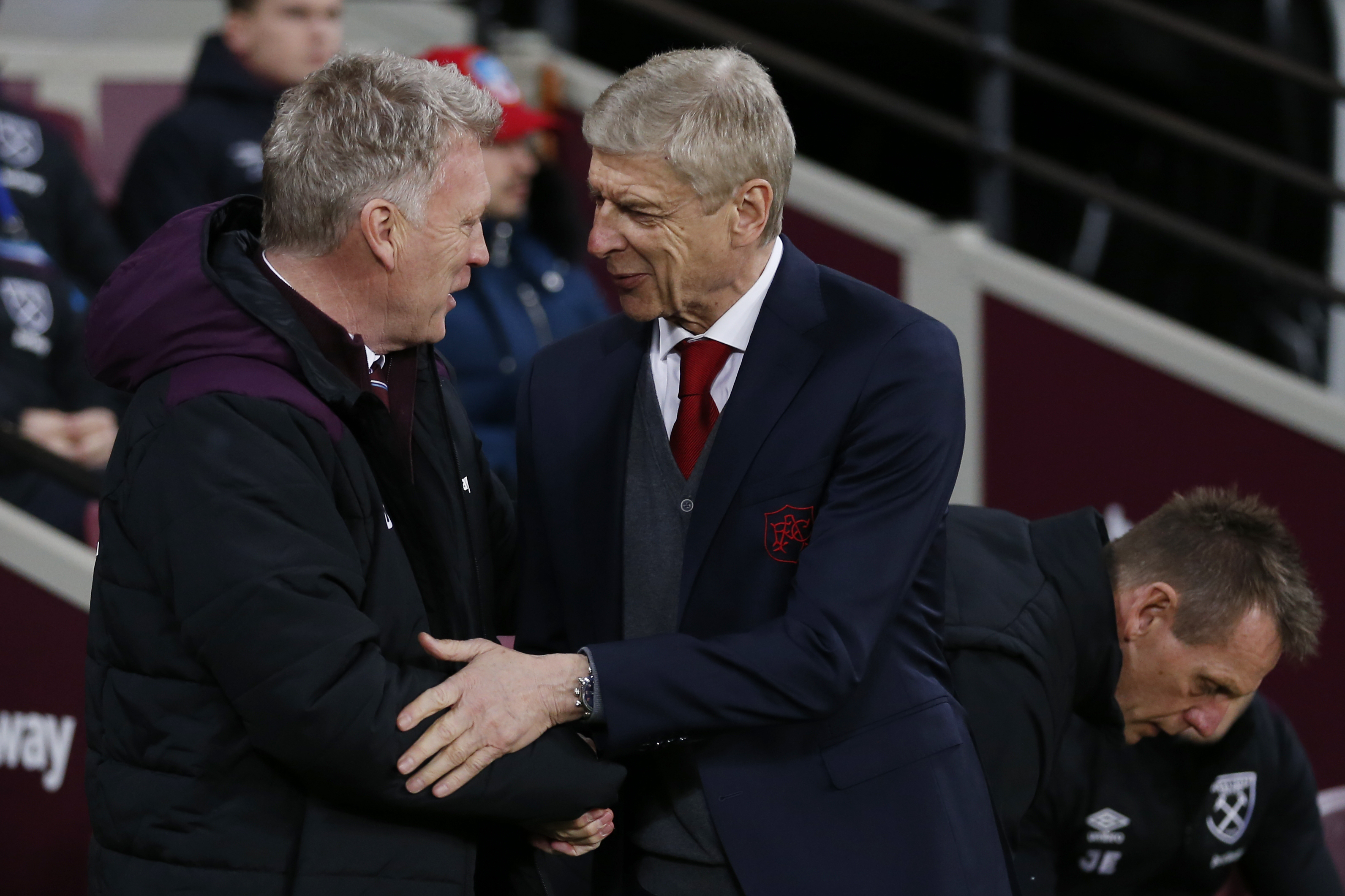 West Ham United's Scottish manager David Moyes (L) greets Arsenal's French manager Arsene Wenger before the English Premier League football match between West Ham United and Arsenal at The London Stadium, in east London on December 13, 2017. / AFP PHOTO / Ian KINGTON / RESTRICTED TO EDITORIAL USE. No use with unauthorized audio, video, data, fixture lists, club/league logos or 'live' services. Online in-match use limited to 75 images, no video emulation. No use in betting, games or single club/league/player publications.  /         (Photo credit should read IAN KINGTON/AFP/Getty Images)