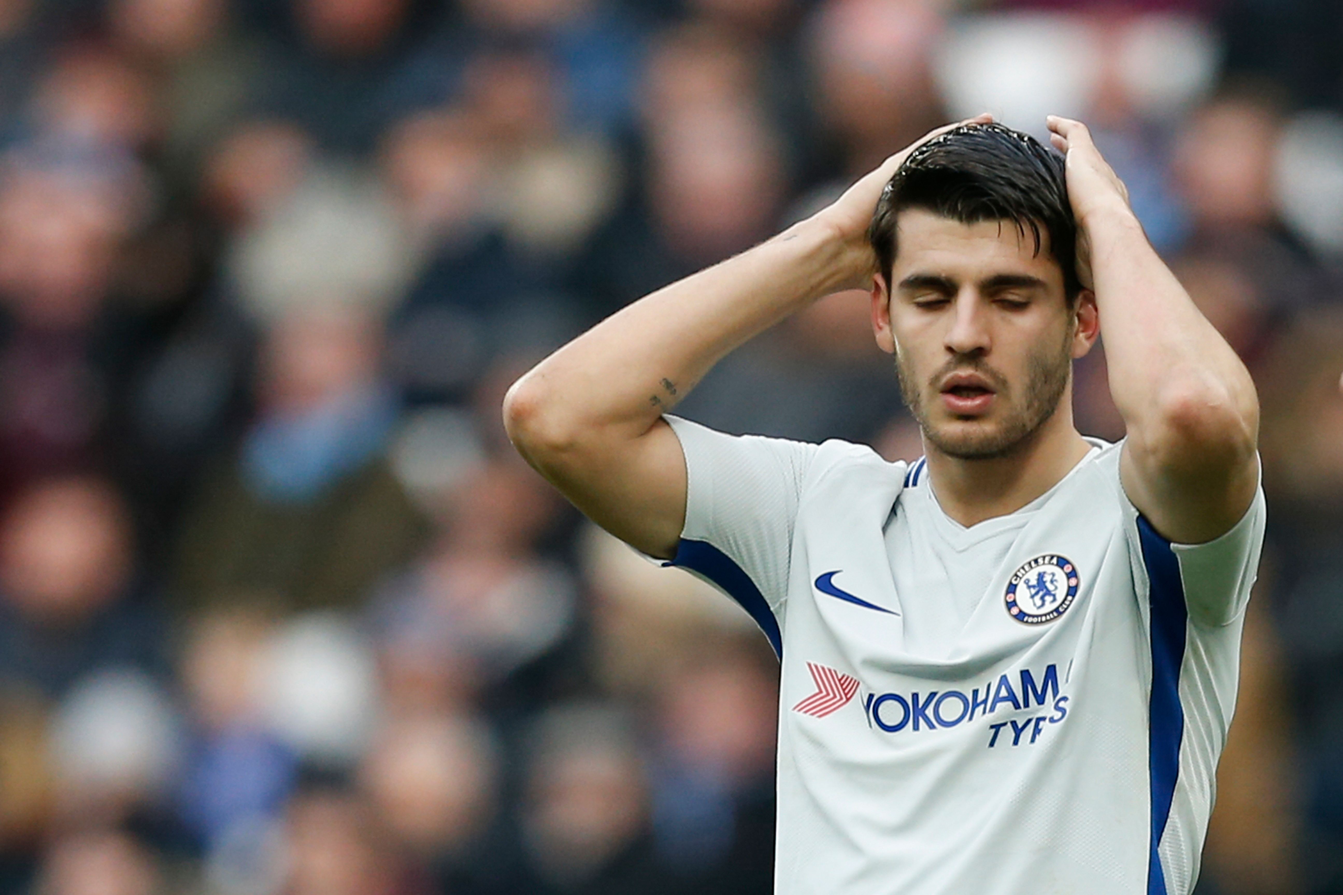 Chelsea's Spanish striker Alvaro Morata reacts after missing a good chance during the English Premier League football match between West Ham United and Chelsea at The London Stadium, in east London on December 9, 2017. / AFP PHOTO / Ian KINGTON / RESTRICTED TO EDITORIAL USE. No use with unauthorized audio, video, data, fixture lists, club/league logos or 'live' services. Online in-match use limited to 75 images, no video emulation. No use in betting, games or single club/league/player publications.  /