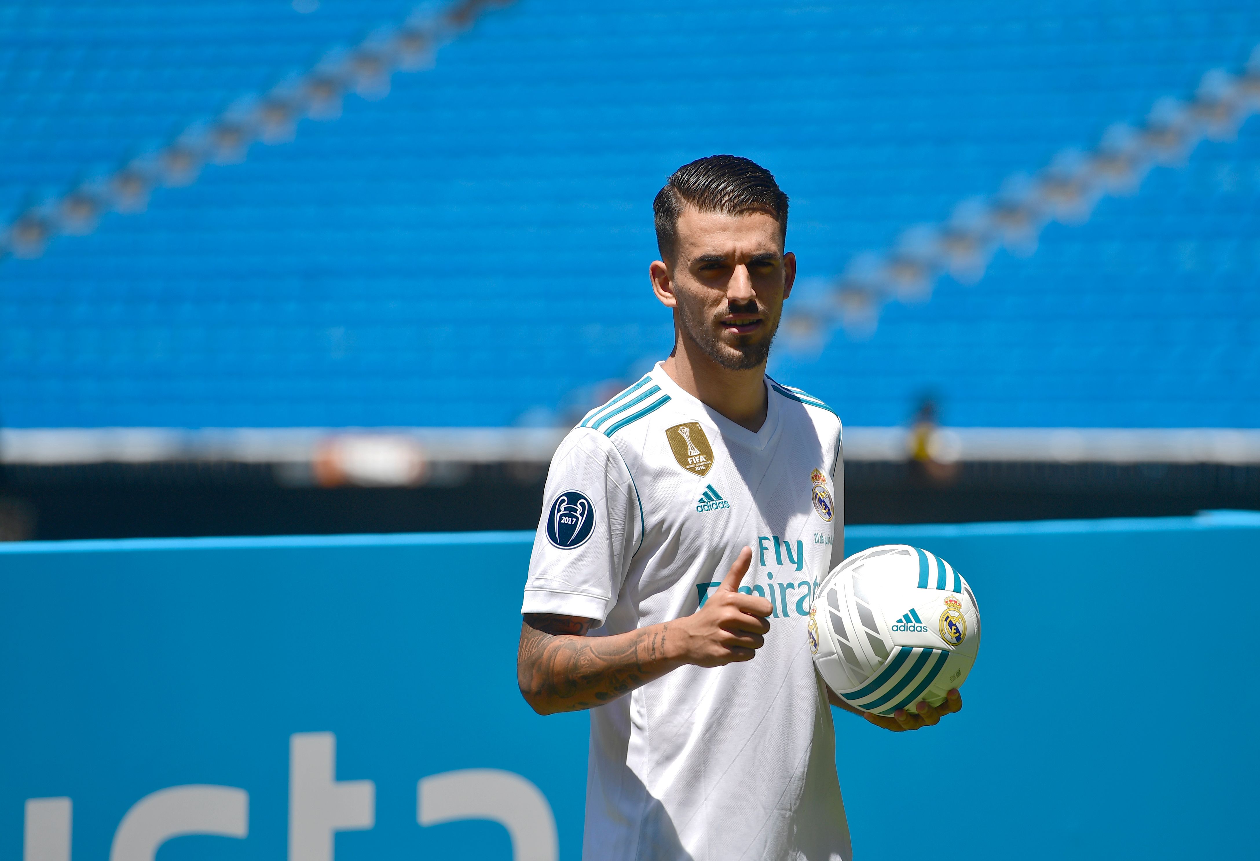 Spanish midfielder Dani Ceballos gives a thumb up as he poses on the pitch during his presentation as new football player of the Real Madrid CF at the Santiago Bernabeu stadium in Madrid on July 20, 2017. / AFP PHOTO / PIERRE-PHILIPPE MARCOU        (Photo credit should read PIERRE-PHILIPPE MARCOU/AFP/Getty Images)