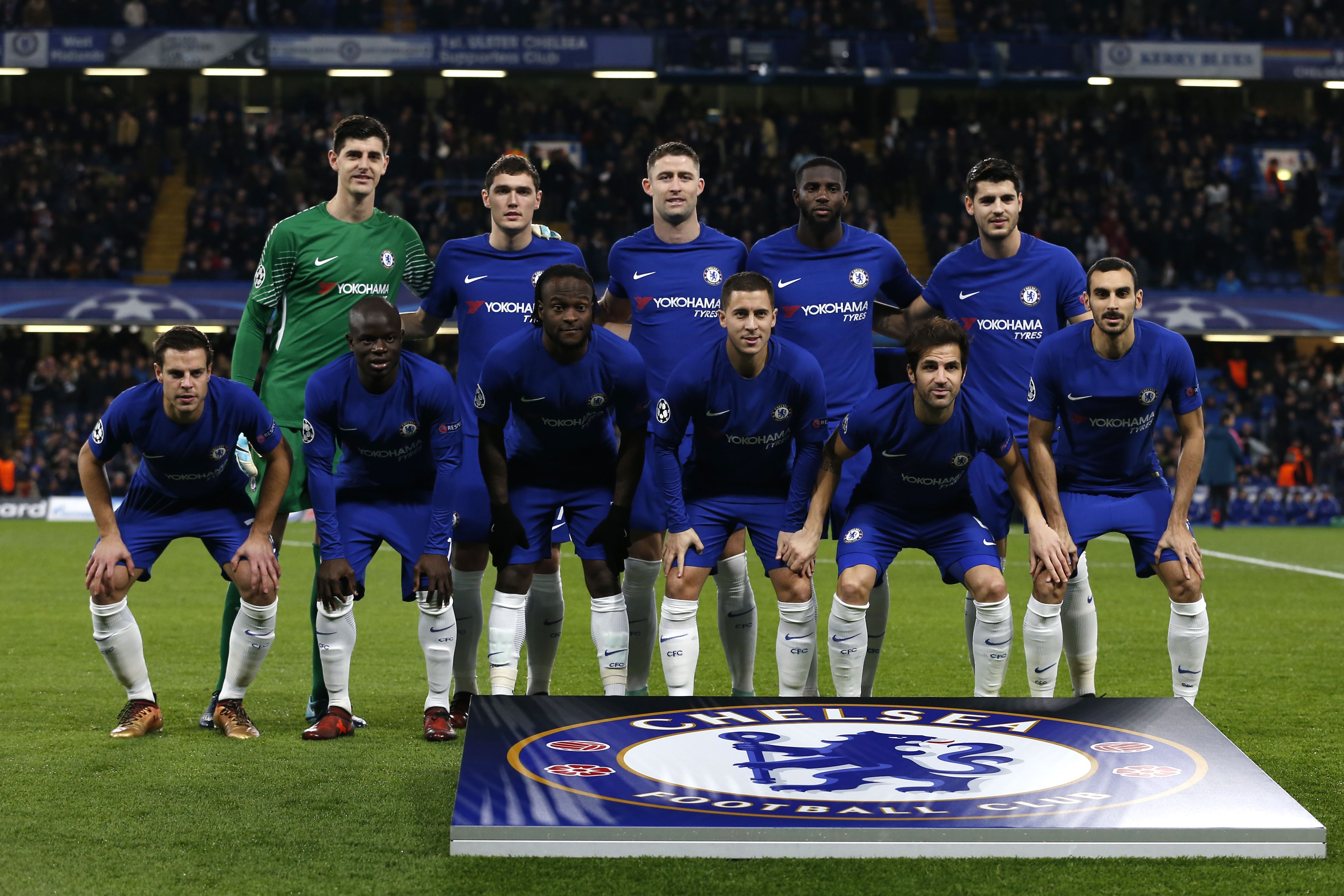 (top L-R) Chelsea's Belgian goalkeeper Thibaut Courtois, Chelsea's Danish defender Andreas Christensen, Chelsea's English defender Gary Cahill, Chelsea's French midfielder Tiemoue Bakayoko and Chelsea's Spanish striker Alvaro Morata (bottom L-R) Chelsea's Spanish defender Cesar Azpilicueta, Chelsea's French midfielder N'Golo Kante, Chelsea's Nigerian midfielder Victor Moses, Chelsea's Belgian midfielder Eden Hazard, Chelsea's Spanish midfielder Cesc Fabregas and Chelsea's Italian defender Davide Zappacosta pose before a UEFA Champions League Group C football match between Chelsea and Atletico Madrid at Stamford Bridge in London on December 5, 2017. / AFP PHOTO / Ian KINGTON        (Photo credit should read IAN KINGTON/AFP/Getty Images)