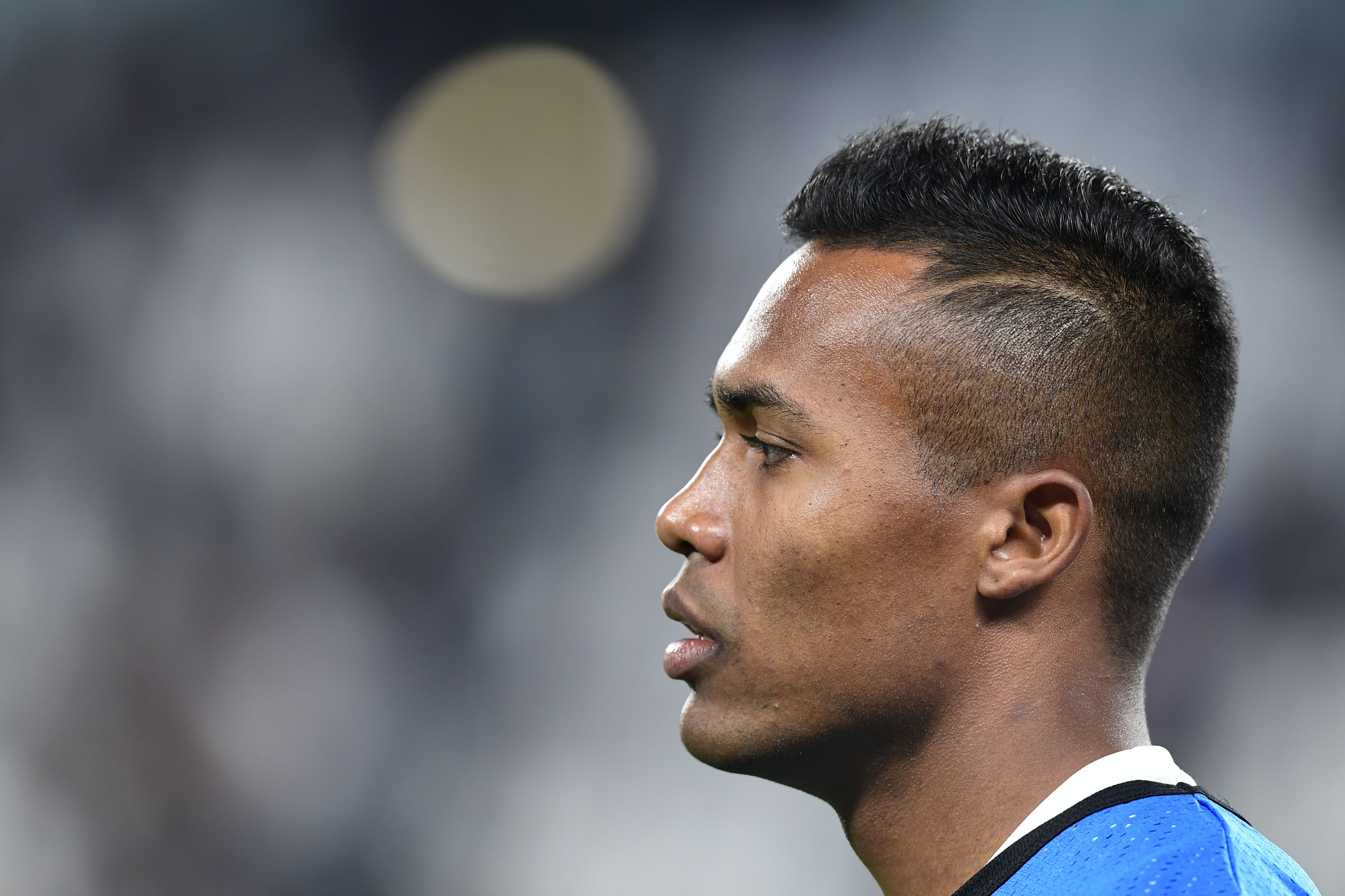 Juventus' defender from Brazil Alex Sandro warms up before the UEFA Champion's League Group D football match Juventus vs Olympiacos on September 27, 2017 at the Juventus stadium in Turin.  / AFP PHOTO / Miguel MEDINA        (Photo credit should read MIGUEL MEDINA/AFP/Getty Images)