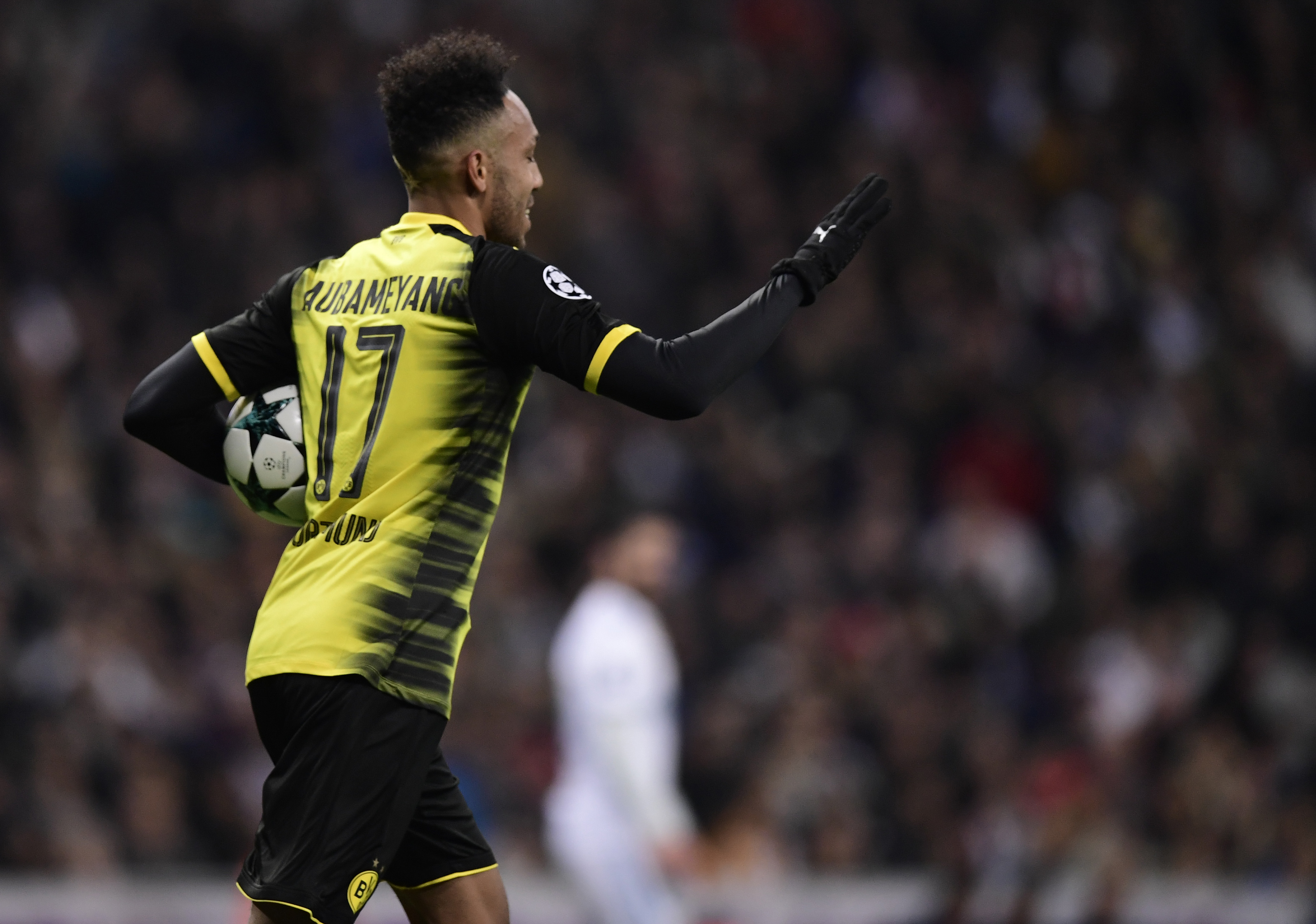 Dortmund's Gabonese forward Pierre-Emerick Aubameyang celebrates a goal during the UEFA Champions League group H football match Real Madrid CF vs Borussia Dortmund at the Santiago Bernabeu stadium in Madrid on December 6, 2017. / AFP PHOTO / JAVIER SORIANO