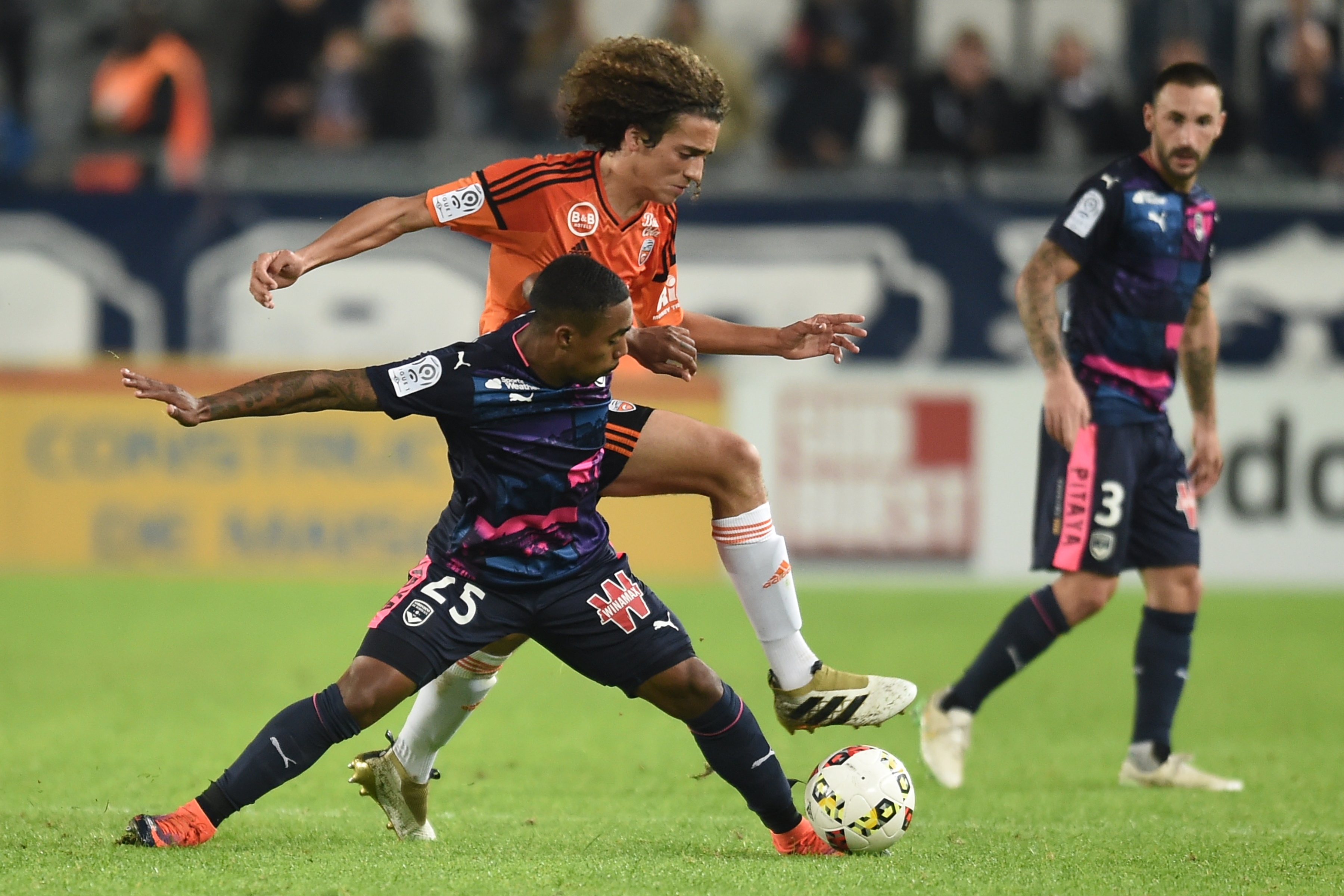 Bordeaux's Brazilian forward Malcom (L) vies with Lorient's midfielder Matteo Guendouzi Olie during the French L1 football match between Bordeaux and Lorient on November 5, 2016 at the Matmut Atlantique stadium in Bordeaux, southwestern France.  / AFP / NICOLAS TUCAT        (Photo credit should read NICOLAS TUCAT/AFP/Getty Images)