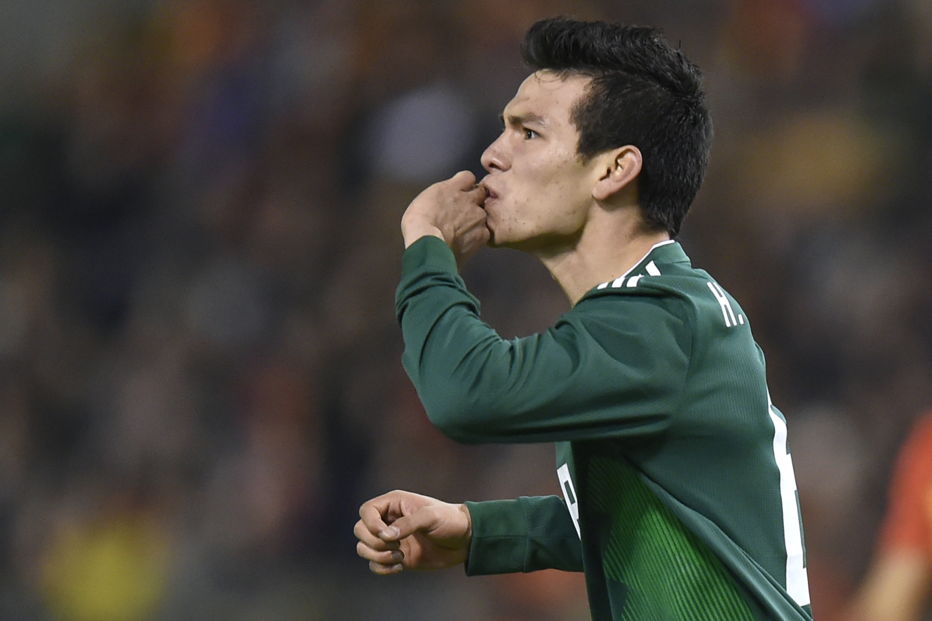 Mexico's forward Hirving Lozano celebrates after scoring a goal  during the international friendly football match between Belgium and Mexico at the King Baudouin Stadium in Brussels on November 10, 2017. / AFP PHOTO / JOHN THYS        (Photo credit should read JOHN THYS/AFP/Getty Images)