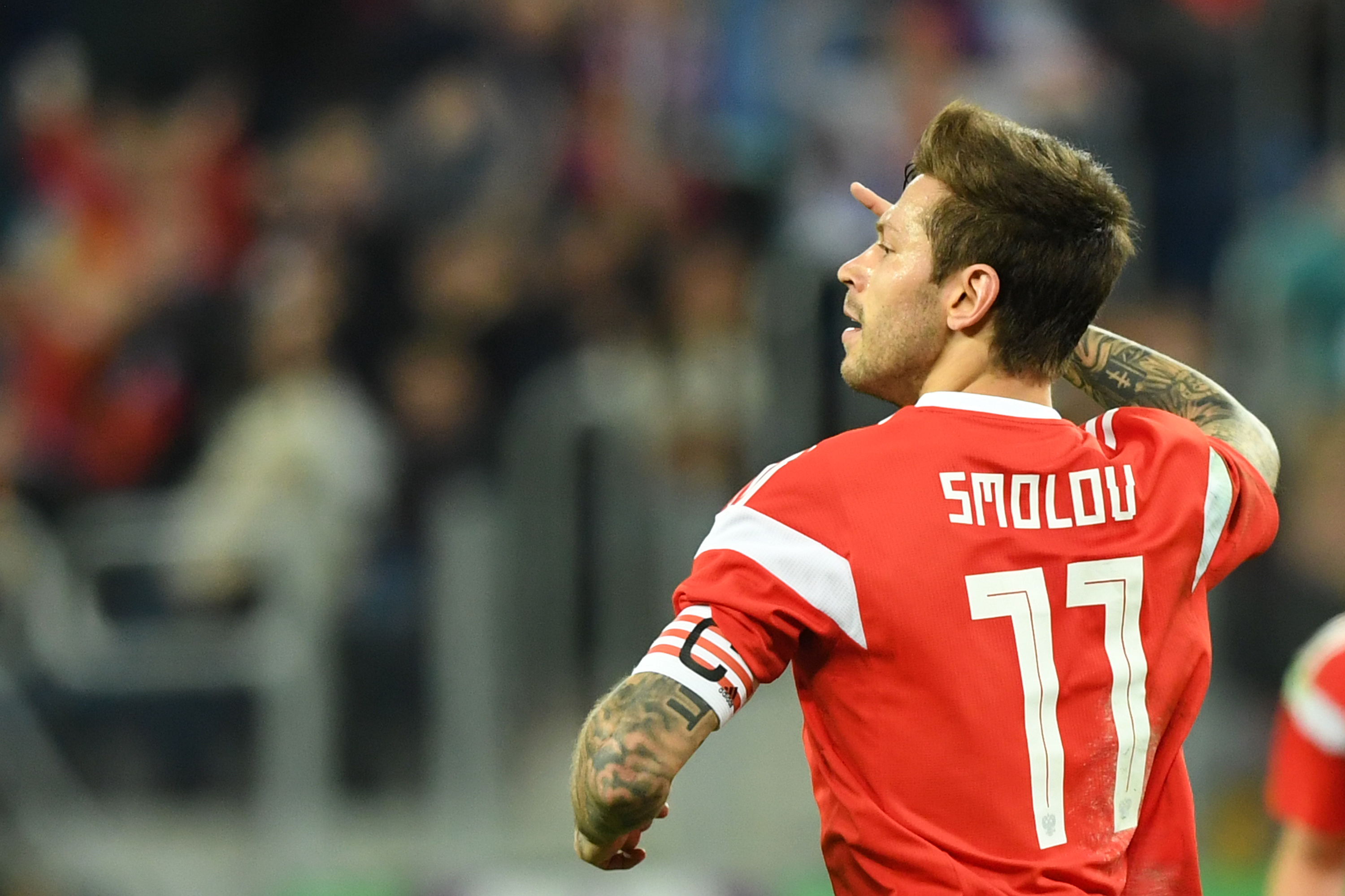 Russia's Fedor Smolov celebrates after scoring the team's third goal during an international friendly football match between Russia and Spain at the Saint Petersburg Stadium in Saint Petersburg on November 14, 2017. / AFP PHOTO / Kirill KUDRYAVTSEV        (Photo credit should read KIRILL KUDRYAVTSEV/AFP/Getty Images)