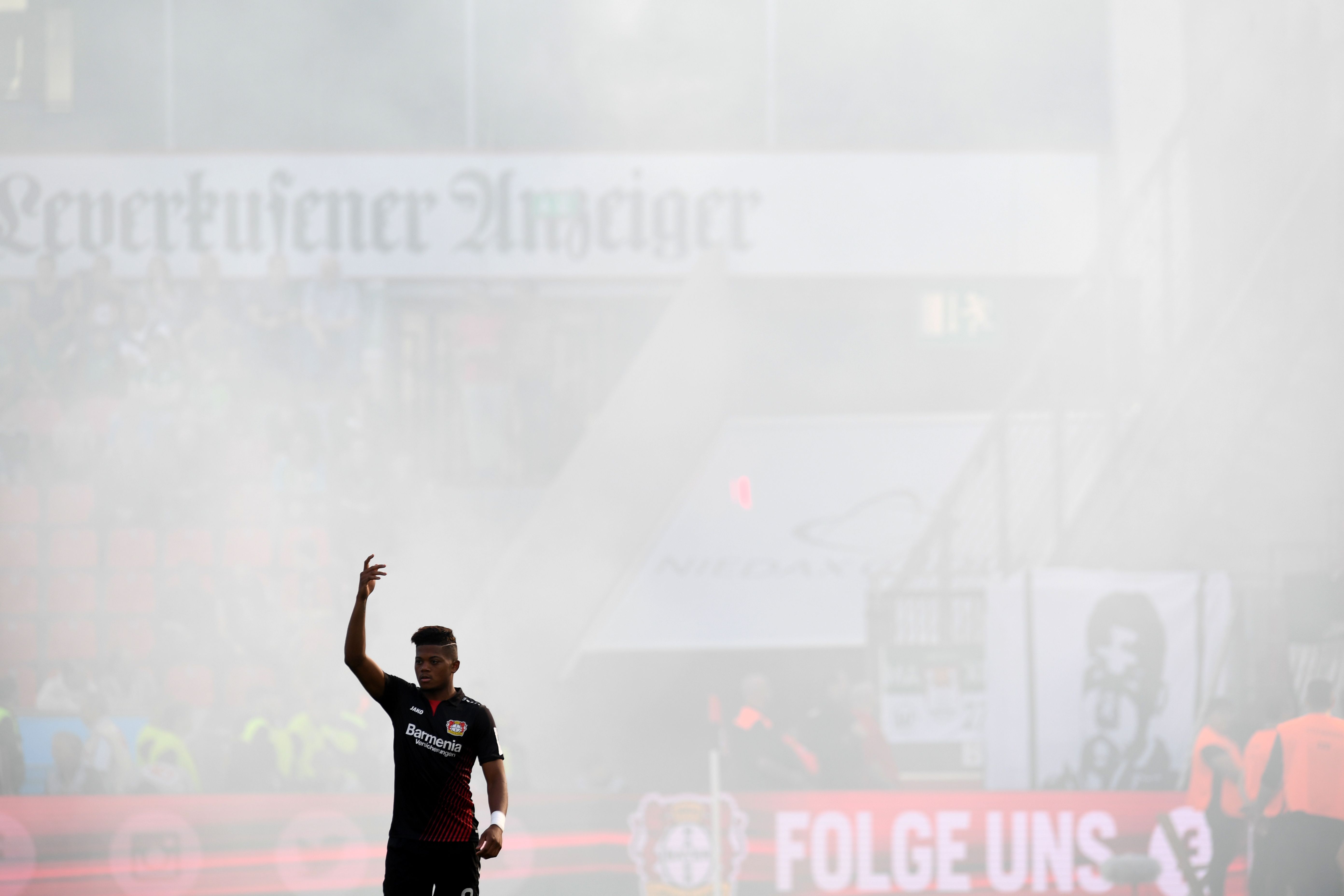 Leverkusen's Jamaican midfielder Leon Bailey reacts during the German first division Bundesliga football match Bayer Leverkusen vs VfL Wolfsburg in Leverkusen, western Germany, on October 15, 2017. / AFP PHOTO / PATRIK STOLLARZ / RESTRICTIONS: DURING MATCH TIME: DFL RULES TO LIMIT THE ONLINE USAGE TO 15 PICTURES PER MATCH AND FORBID IMAGE SEQUENCES TO SIMULATE VIDEO. == RESTRICTED TO EDITORIAL USE == FOR FURTHER QUERIES PLEASE CONTACT DFL DIRECTLY AT + 49 69 650050
        (Photo credit should read PATRIK STOLLARZ/AFP/Getty Images)