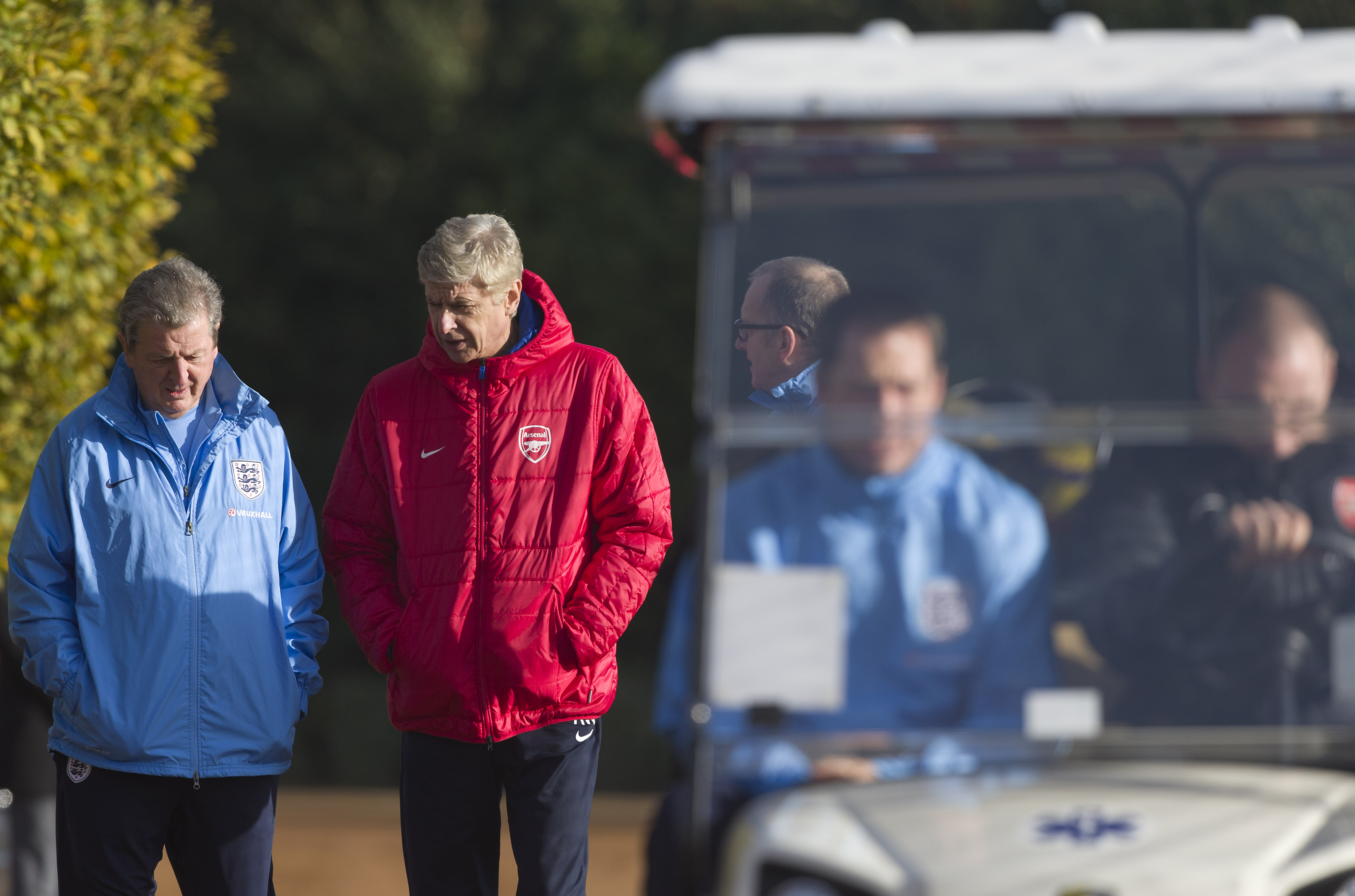 England manager Roy Hodgson (L) walk with Arsenal's French manager Arsene Wenger (R) ahead of an England training session at Arsenal's training ground, London Colney, north of London on November 13, 2013 ahead of their forthcoming international friendly football match against Chile.    AFP PHOTO / JUSTIN TALLIS - NOT FOR MARKETING OR ADVERTISING USE / RESTRICTED TO EDITORIAL USE        (Photo credit should read JUSTIN TALLIS/AFP/Getty Images)