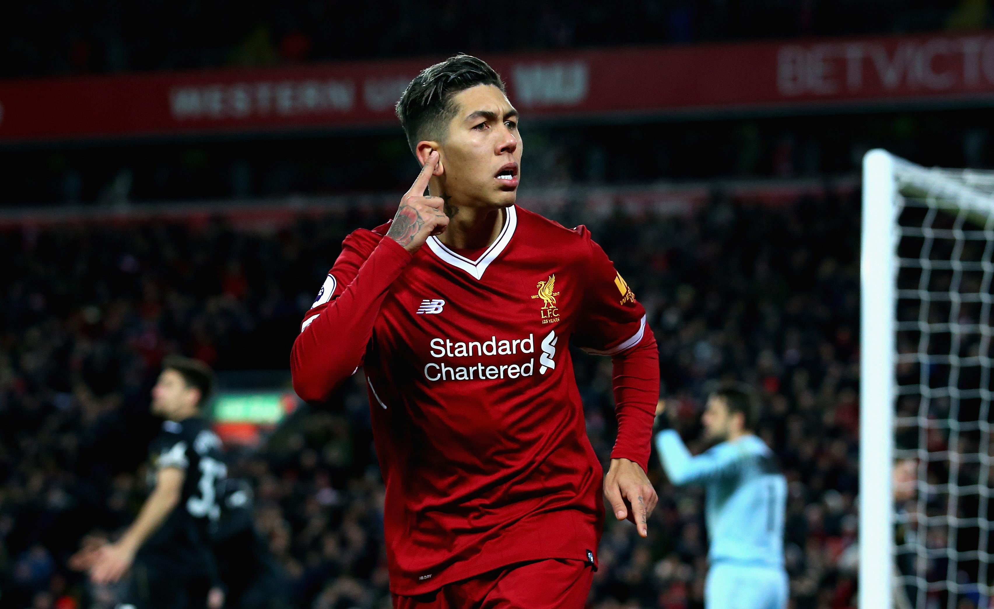 LIVERPOOL, ENGLAND - DECEMBER 26:  Roberto Firmino of Liverpool celebrates after scoring his sides second goal during the Premier League match between Liverpool and Swansea City at Anfield on December 26, 2017 in Liverpool, England.  (Photo by Jan Kruger/Getty Images)