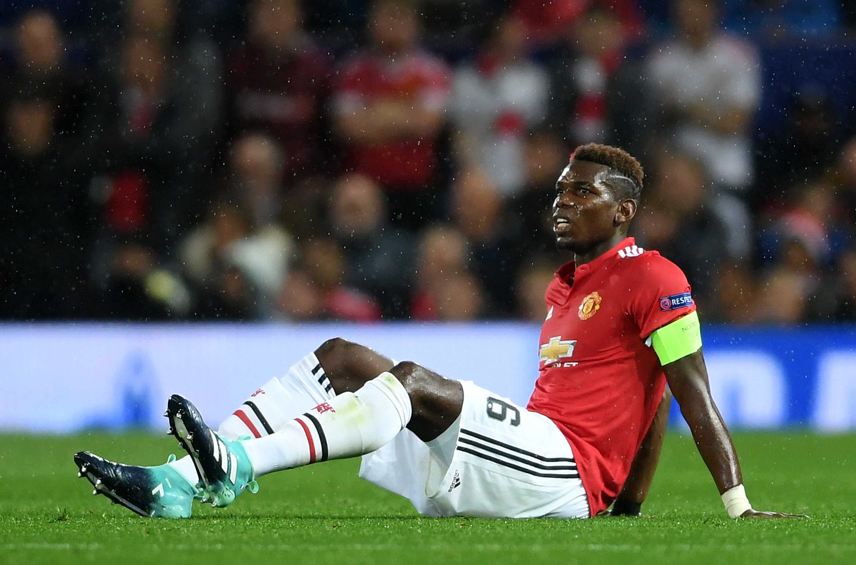 MANCHESTER, ENGLAND - SEPTEMBER 12: Paul Pogba of Manchester United goes down injured during the UEFA Champions League Group A match between Manchester United and FC Basel at Old Trafford on September 12, 2017 in Manchester, United Kingdom.  (Photo by Laurence Griffiths/Getty Images)