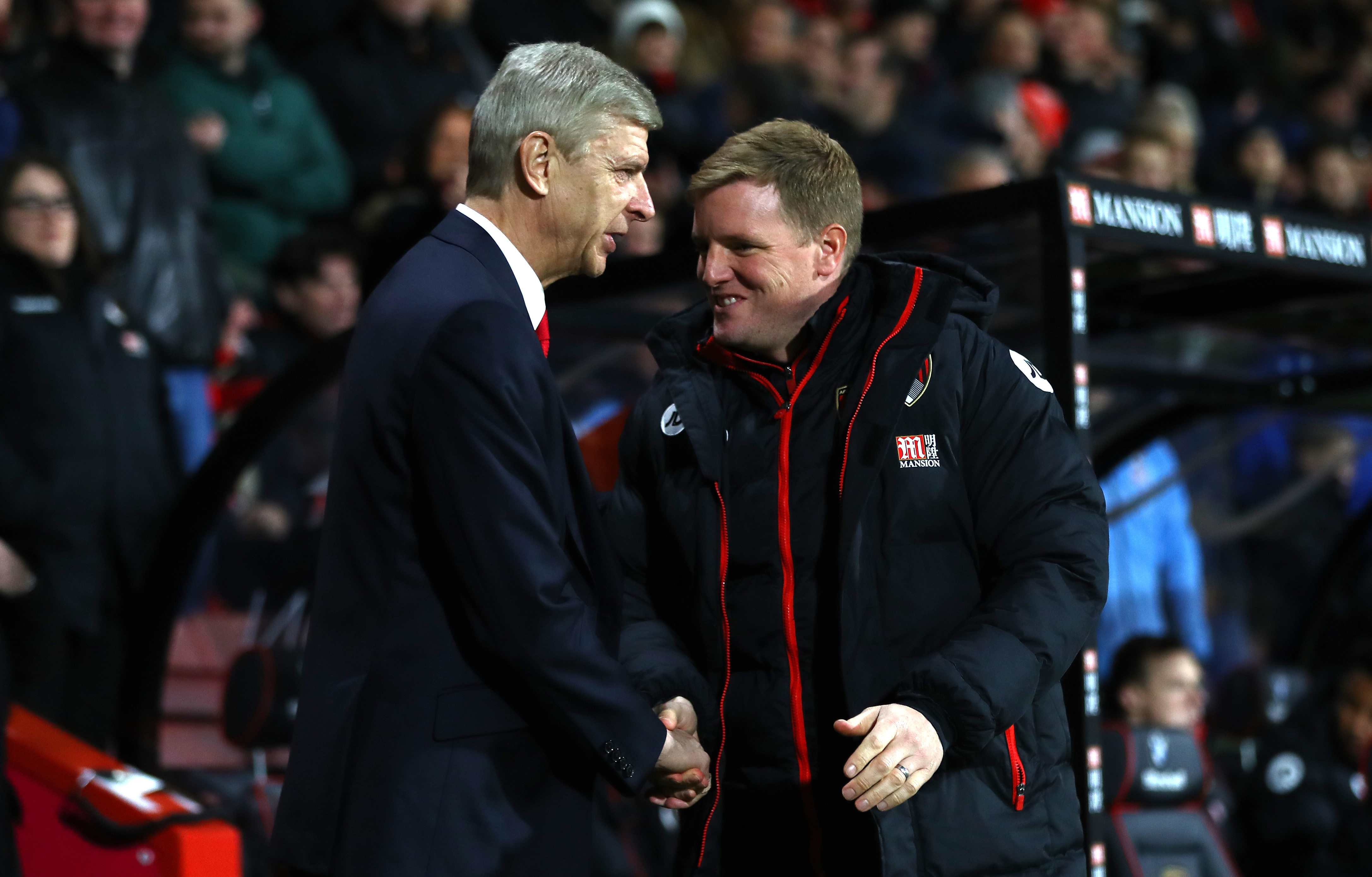 BOURNEMOUTH, ENGLAND - JANUARY 03:  Arsene Wenger, Manager of Arsenal and Eddie Howe, Manager of AFC Bournemouth shake hands prior to the Premier League match between AFC Bournemouth and Arsenal at Vitality Stadium on January 3, 2017 in Bournemouth, England.  (Photo by Michael Steele/Getty Images)