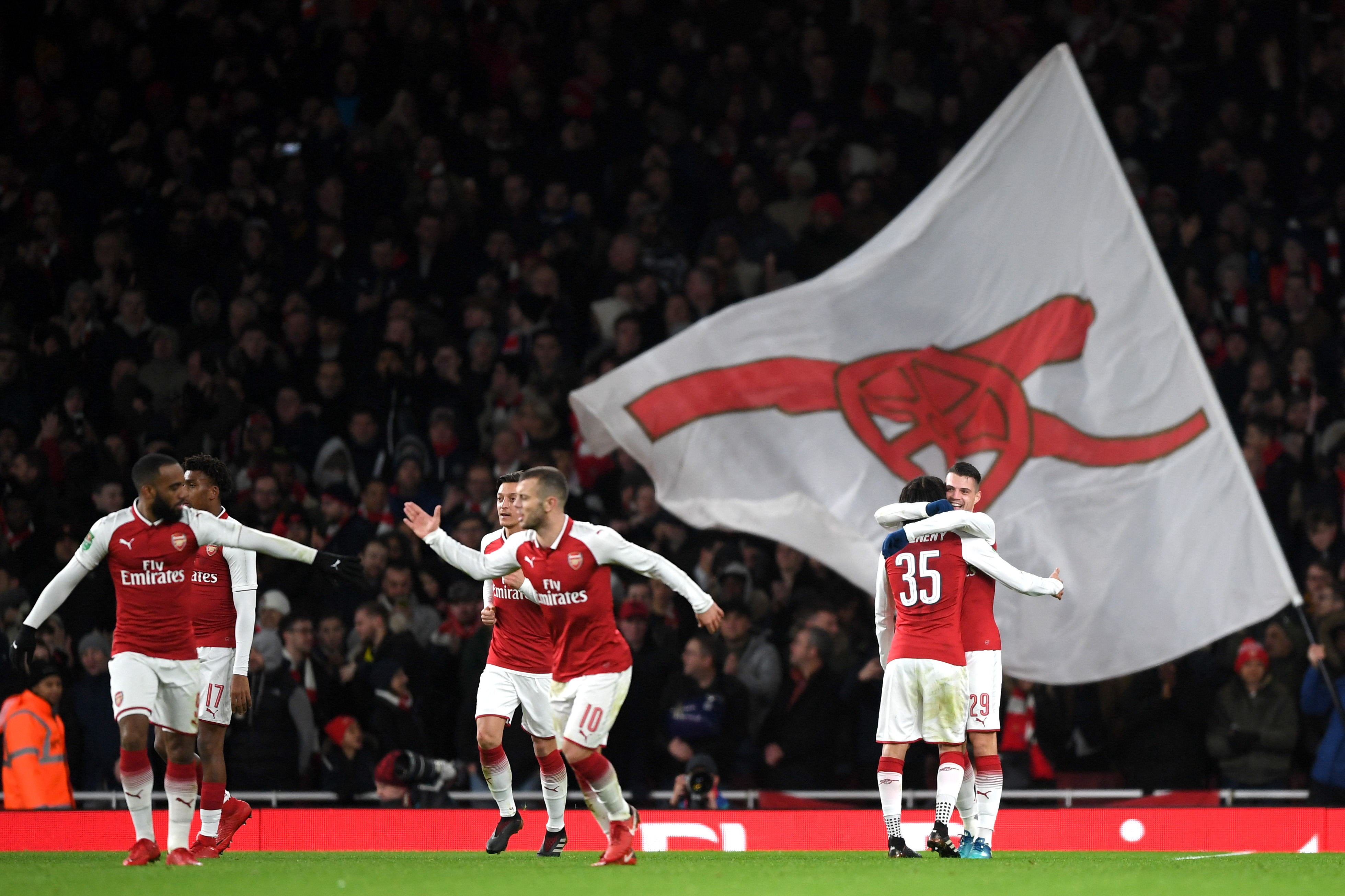 LONDON, ENGLAND - JANUARY 24:  Granit Xhaka of Arsenal celebrates with team mates after scoring his sides second goal during the Carabao Cup Semi-Final Second Leg at Emirates Stadium on January 24, 2018 in London, England.  (Photo by Shaun Botterill/Getty Images)