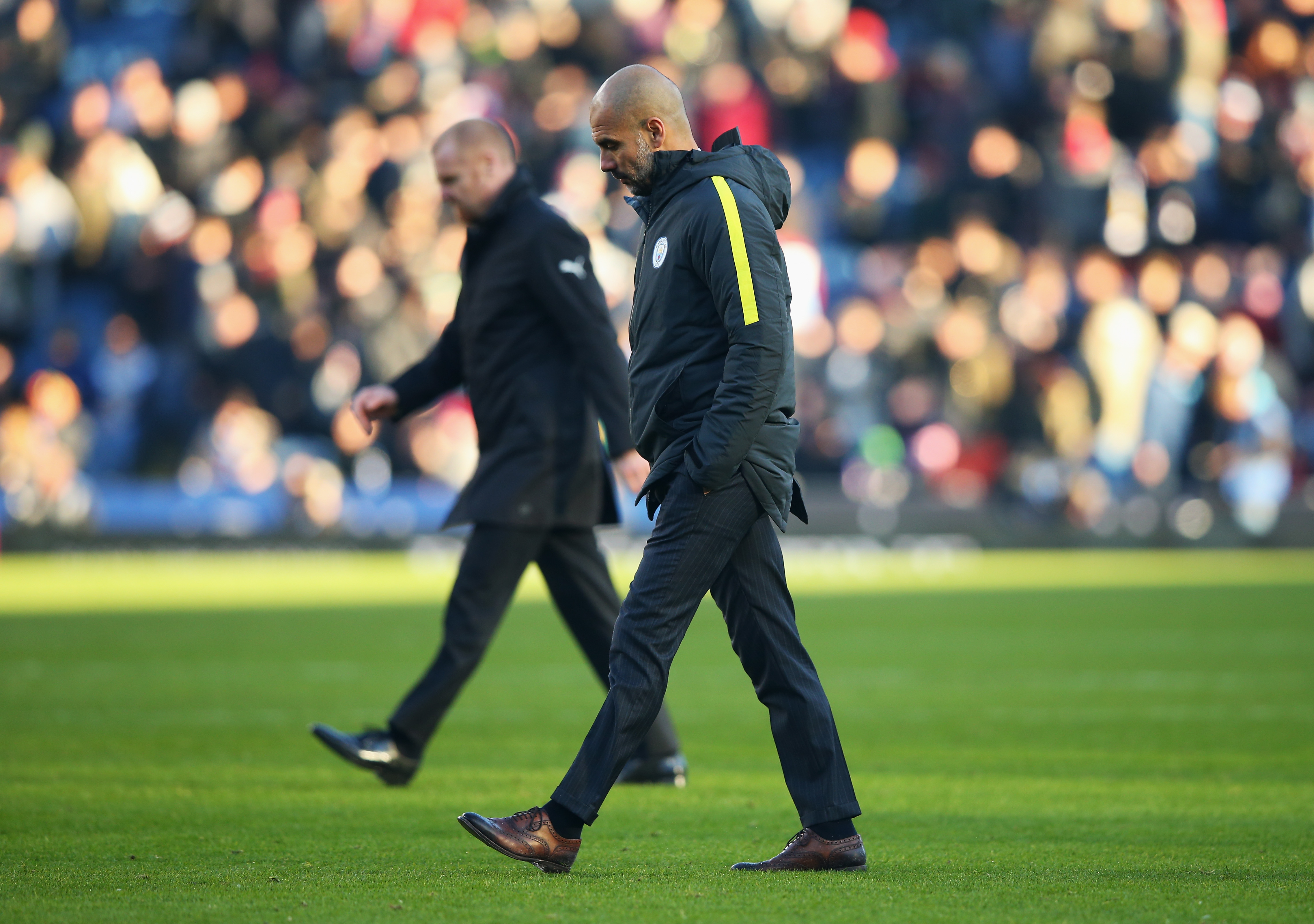 BURNLEY, ENGLAND - NOVEMBER 26: Josep Guardiola, Manager of Manchester City walks off the pitch at the half time during the Premier League match between Burnley and Manchester City at Turf Moor on November 26, 2016 in Burnley, England.  (Photo by Alex Livesey/Getty Images)