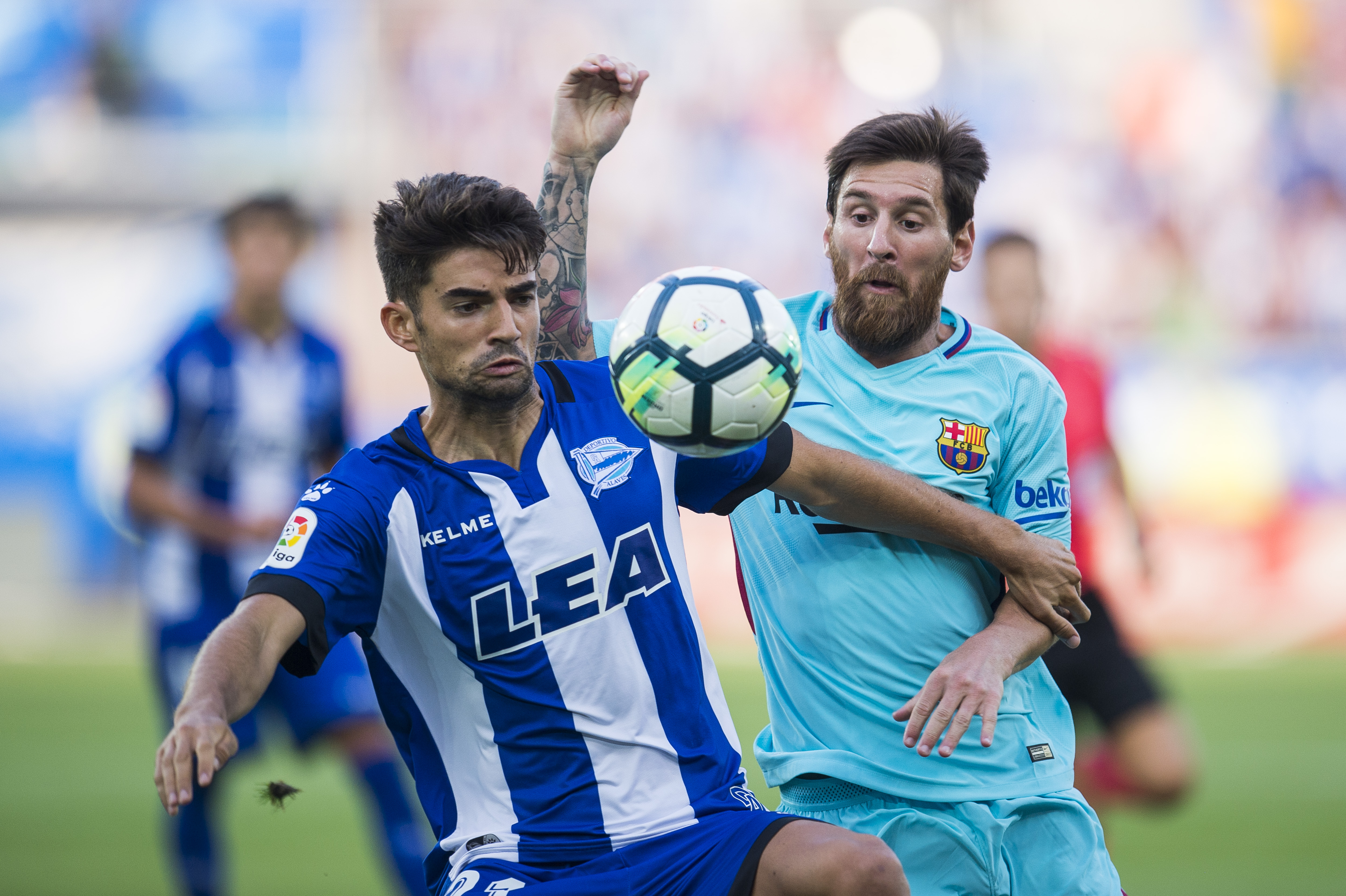 VITORIA-GASTEIZ, SPAIN - AUGUST 26:  Lionel Messi of FC Barcelona duels for the ball with Enzo Zidane of Deportivo Alaves during the La Liga match between Deportivo Alaves and Barcelona at Estadio de Mendizorroza on August 26, 2017 in Vitoria-Gasteiz, Spain .  (Photo by Juan Manuel Serrano Arce/Getty Images)