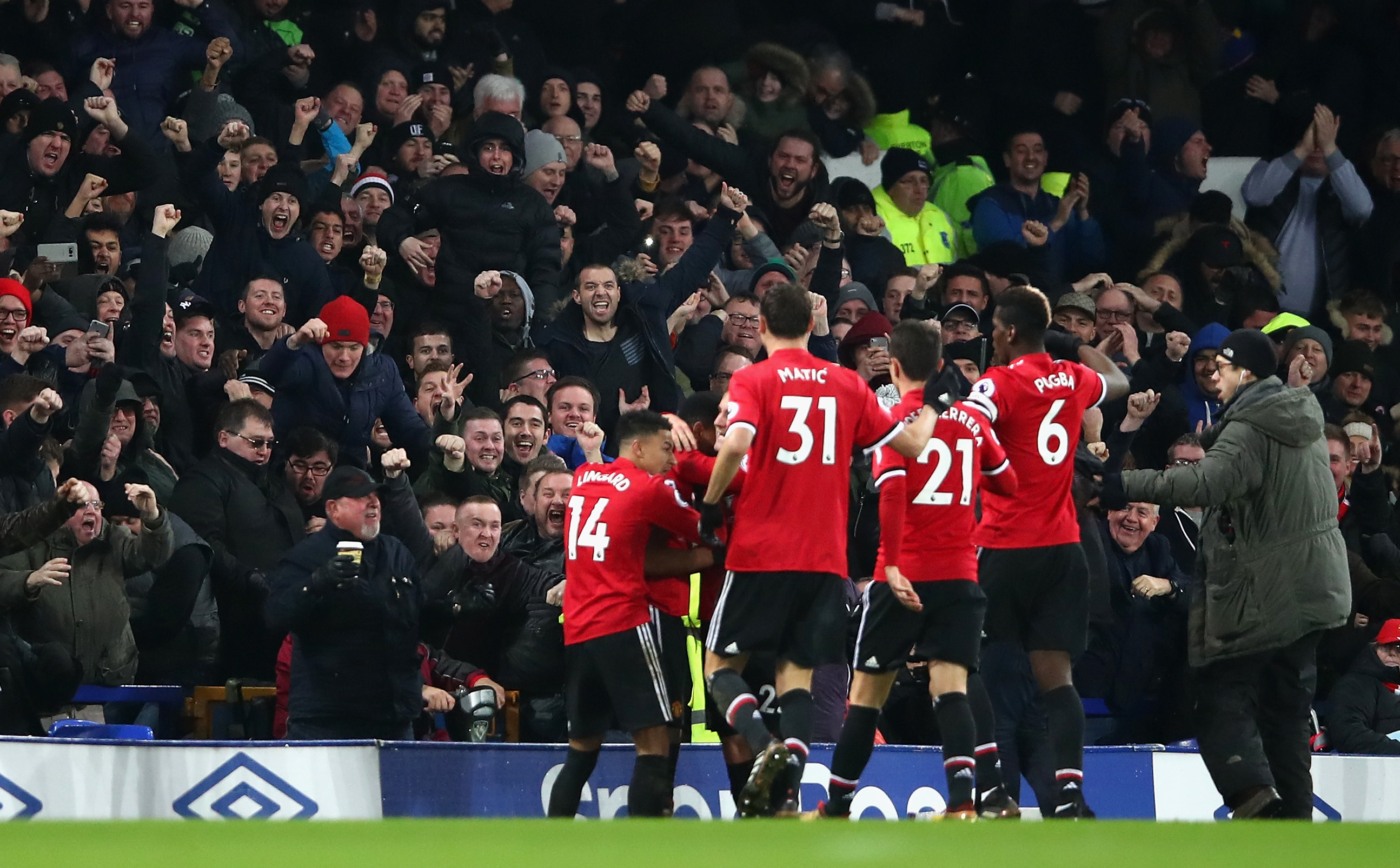 LIVERPOOL, ENGLAND - JANUARY 01:  Anthony Martial of Manchester United celebrates with team mates after scoring his sides first goal during the Premier League match between Everton and Manchester United at Goodison Park on January 1, 2018 in Liverpool, England.  (Photo by Clive Brunskill/Getty Images)