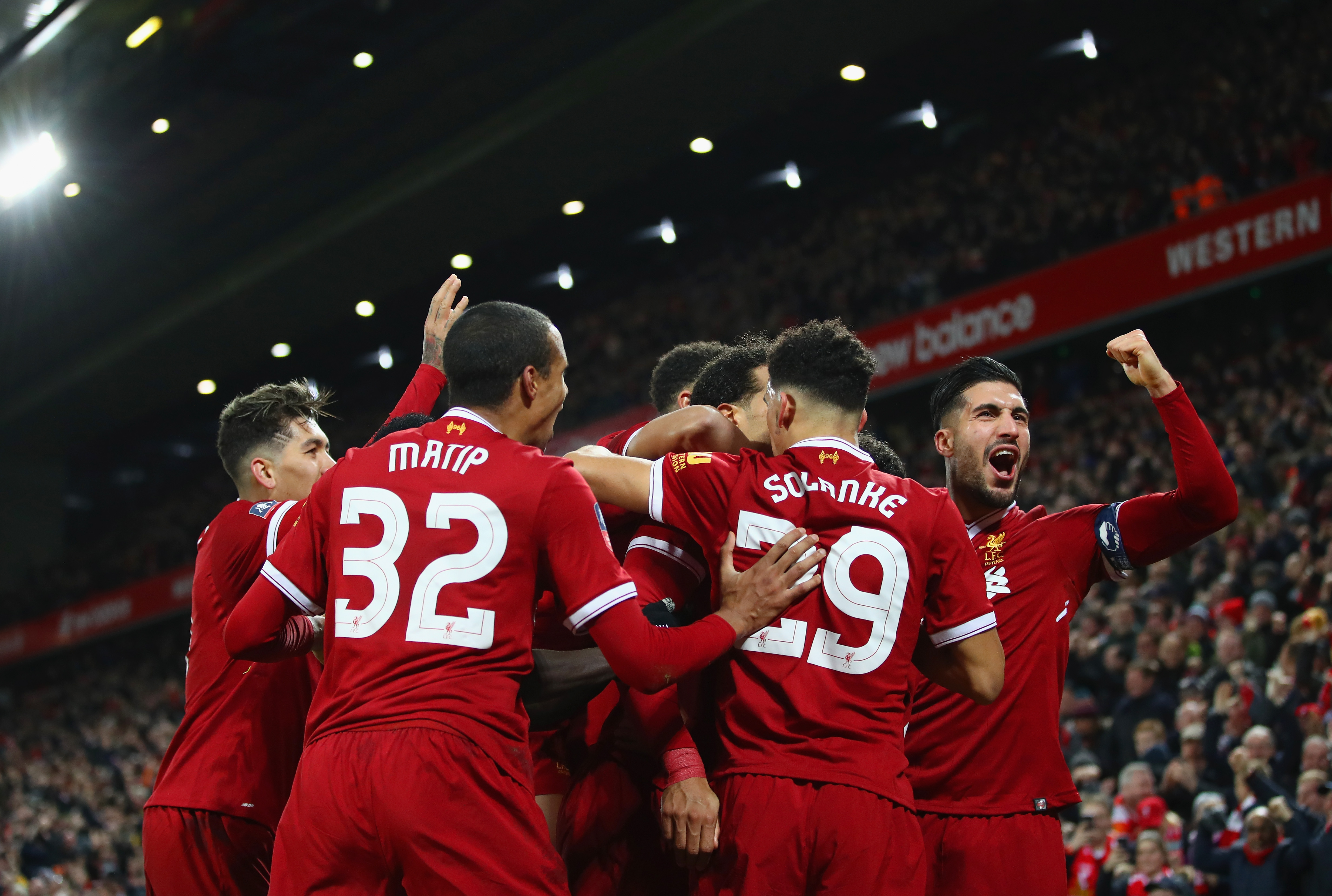 LIVERPOOL, ENGLAND - JANUARY 05:  Emre Can of Liverpool (R) and team mates congratulate Virgil van Dijk of Liverpool (obscured) as he scores their second goal during the Emirates FA Cup Third Round match between Liverpool and Everton at Anfield on January 5, 2018 in Liverpool, England.  (Photo by Clive Brunskill/Getty Images)