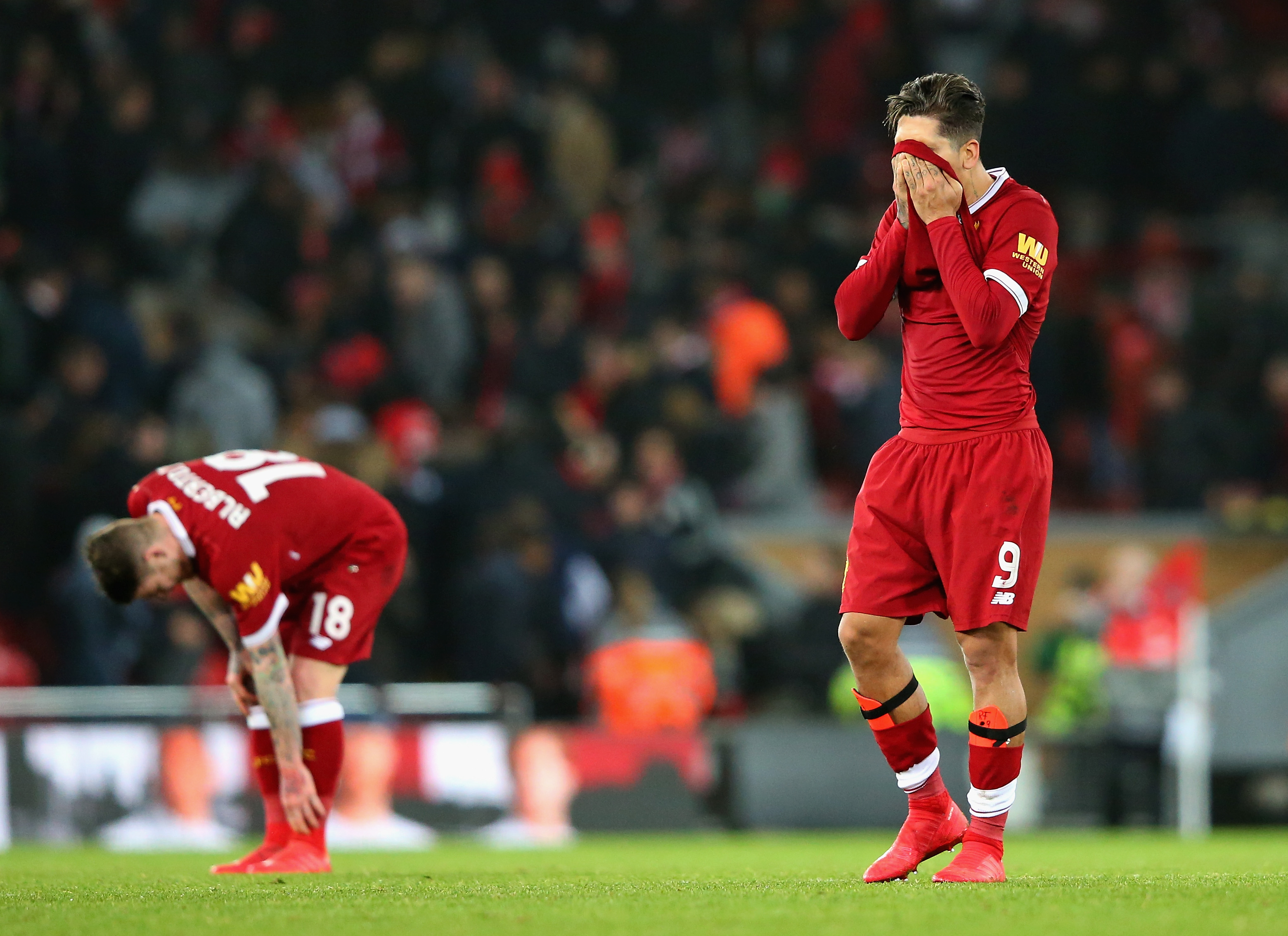 LIVERPOOL, ENGLAND - JANUARY 27:  Roberto Firmino of Liverpool looks dejected following defeat during The Emirates FA Cup Fourth Round match between Liverpool and West Bromwich Albion at Anfield on January 27, 2018 in Liverpool, England.  (Photo by Alex Livesey/Getty Images)