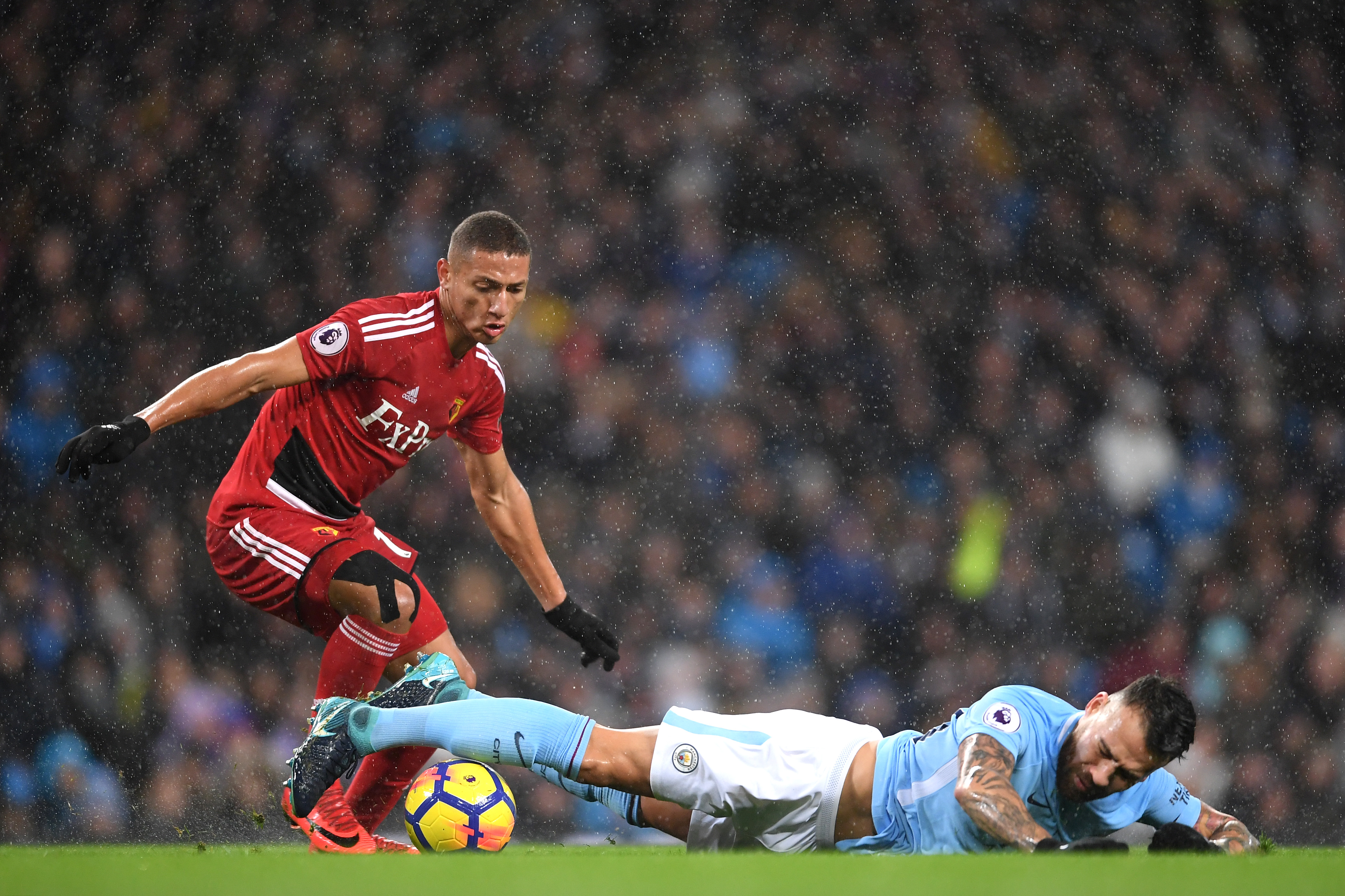 MANCHESTER, ENGLAND - JANUARY 02: Nicolas Otamendi of Manchester City is fouled by Richarlison de Andrade of Watford during the Premier League match between Manchester City and Watford at Etihad Stadium on January 2, 2018 in Manchester, England.  (Photo by Laurence Griffiths/Getty Images)