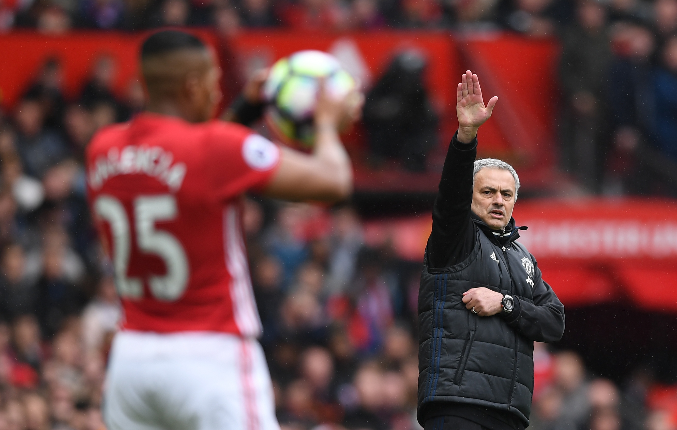 MANCHESTER, ENGLAND - APRIL 16:  Jose Mourinho manager of Manchester United signals as Antonio Valencia of Manchester United takes a throw in during the Premier League match between Manchester United and Chelsea at Old Trafford on April 16, 2017 in Manchester, England.  (Photo by Shaun Botterill/Getty Images)