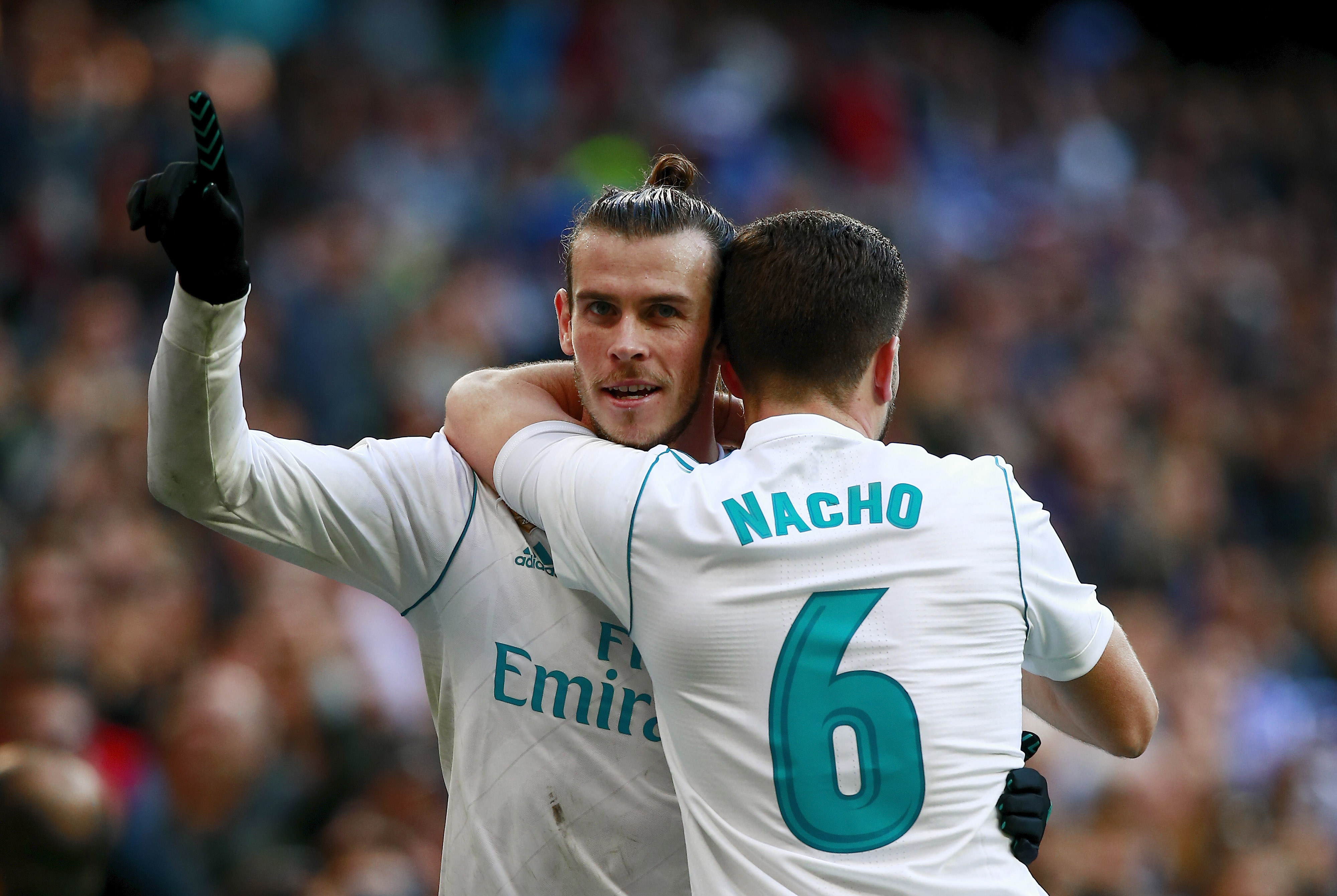 MADRID, SPAIN - JANUARY 21: Gareth Bale (L) of Real Madrid CF celebrates scoring their second goal with teammate Nacho Fernandez (R) during the La Liga match between Real Madrid CF and Deportivo La Coruna at Estadio Santiago Bernabeu on January 21, 2018 in Madrid, Spain. (Photo by Gonzalo Arroyo Moreno/Getty Images)