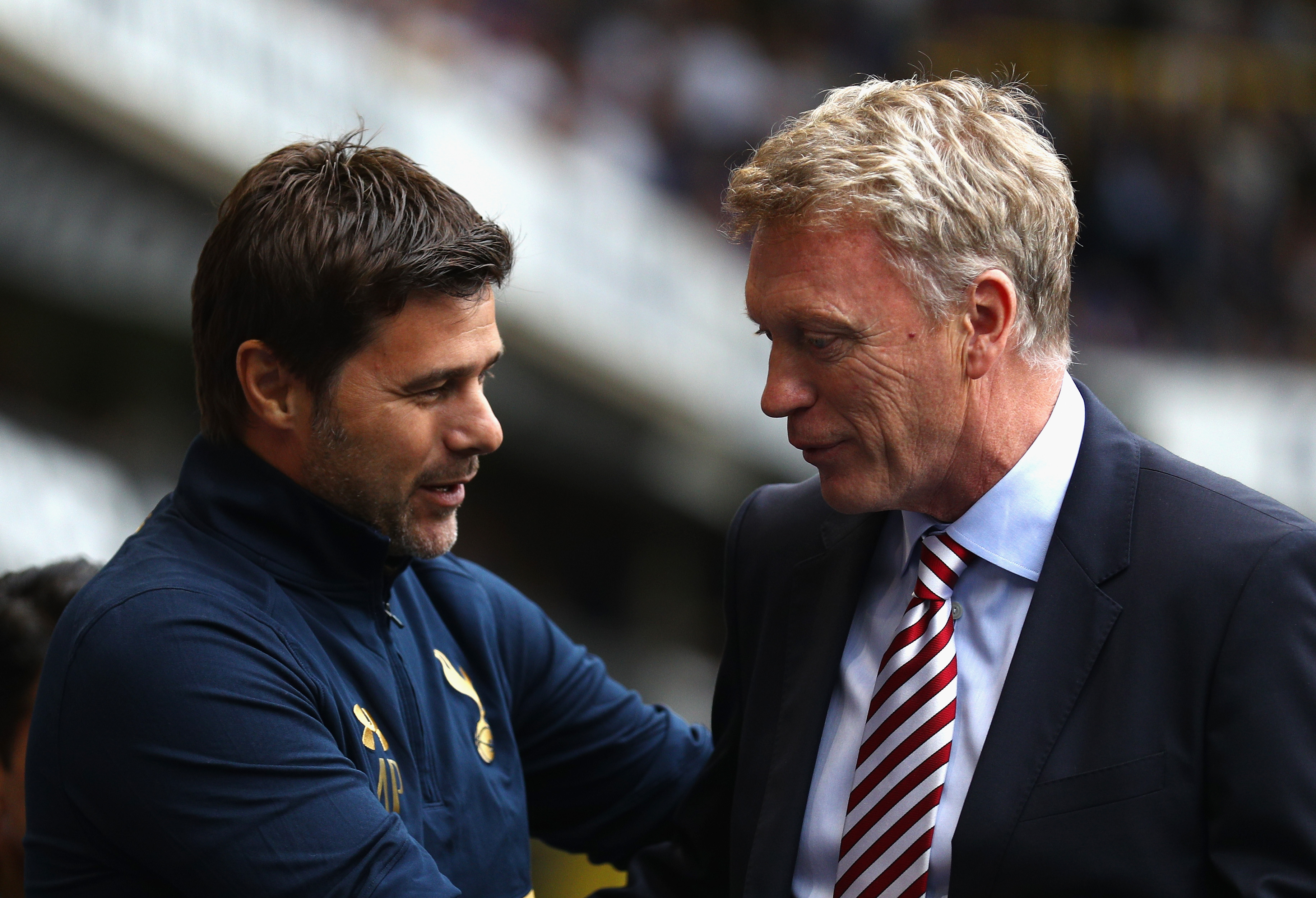LONDON, ENGLAND - SEPTEMBER 18:  Mauricio Pochettino, Manager of Tottenham Hotspur (L) and David Moyes, Manager of Sunderland (R) embrace before kick off during the Premier League match between Tottenham Hotspur and Sunderland at White Hart Lane on September 18, 2016 in London, England.  (Photo by Paul Gilham/Getty Images)