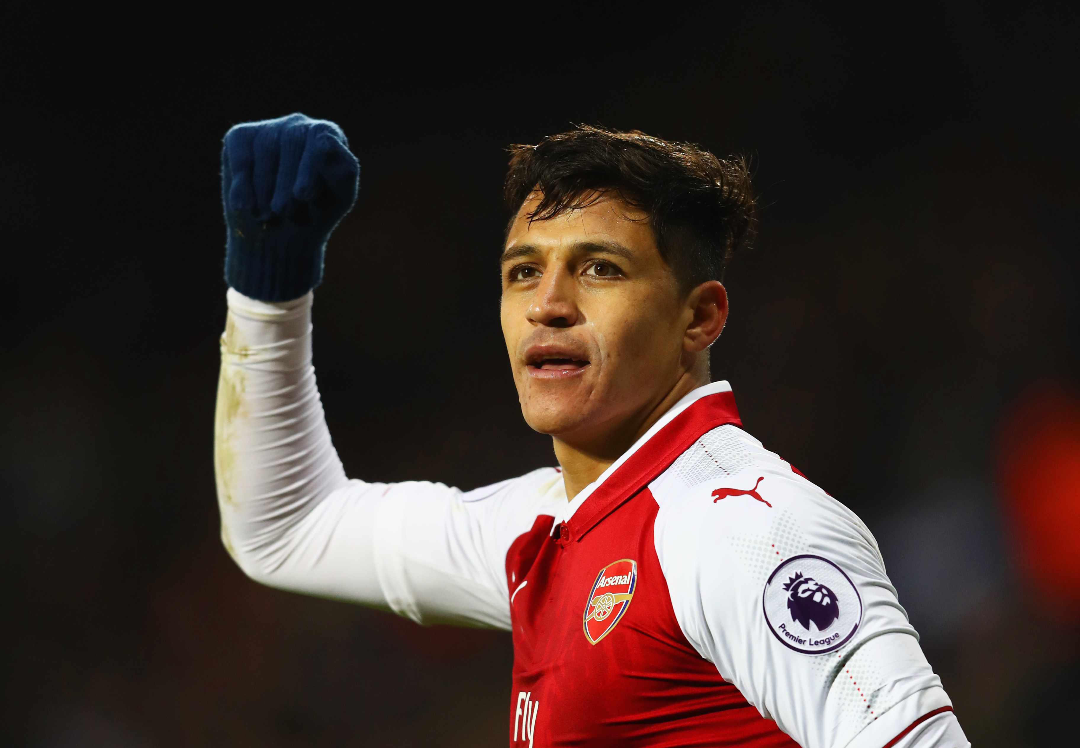 WEST BROMWICH, ENGLAND - DECEMBER 31:  Alexis Sanchez of Arsenal celebrates as his free kick deflects off James McClean of West Bromwich Albion for their first goal during the Premier League match between West Bromwich Albion and Arsenal at The Hawthorns on December 31, 2017 in West Bromwich, England.  (Photo by Michael Steele/Getty Images)