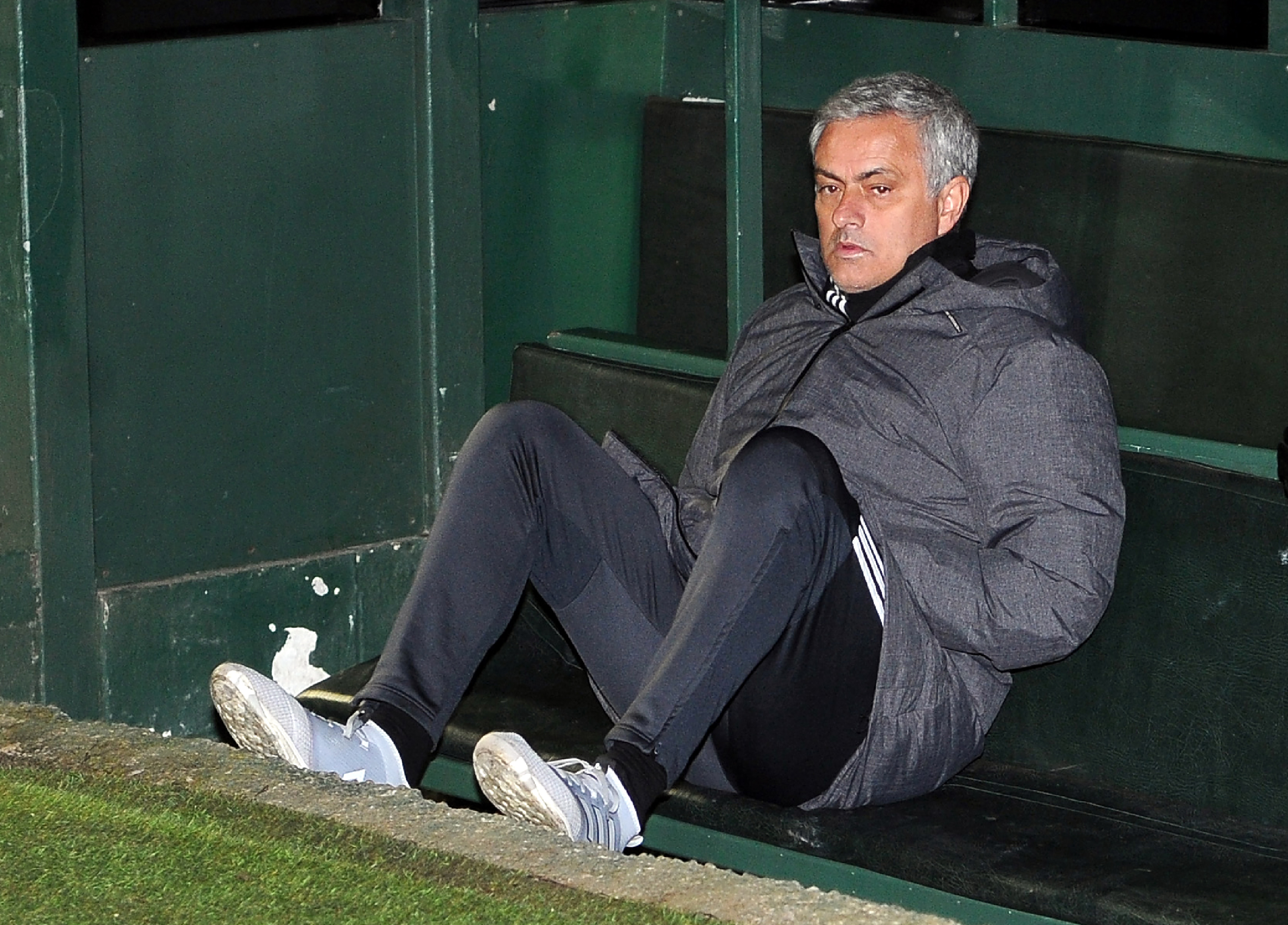 Manchester United's Portuguese manager Jose Mourinho sits in the dugout  ahead of the FA Cup fourth round football match between Yeovil Town and Manchester United at Huish Park in Yeovil, Somerset on January 26, 2018. / AFP PHOTO / - / RESTRICTED TO EDITORIAL USE. No use with unauthorized audio, video, data, fixture lists, club/league logos or 'live' services. Online in-match use limited to 75 images, no video emulation. No use in betting, games or single club/league/player publications.  /         (Photo credit should read -/AFP/Getty Images)