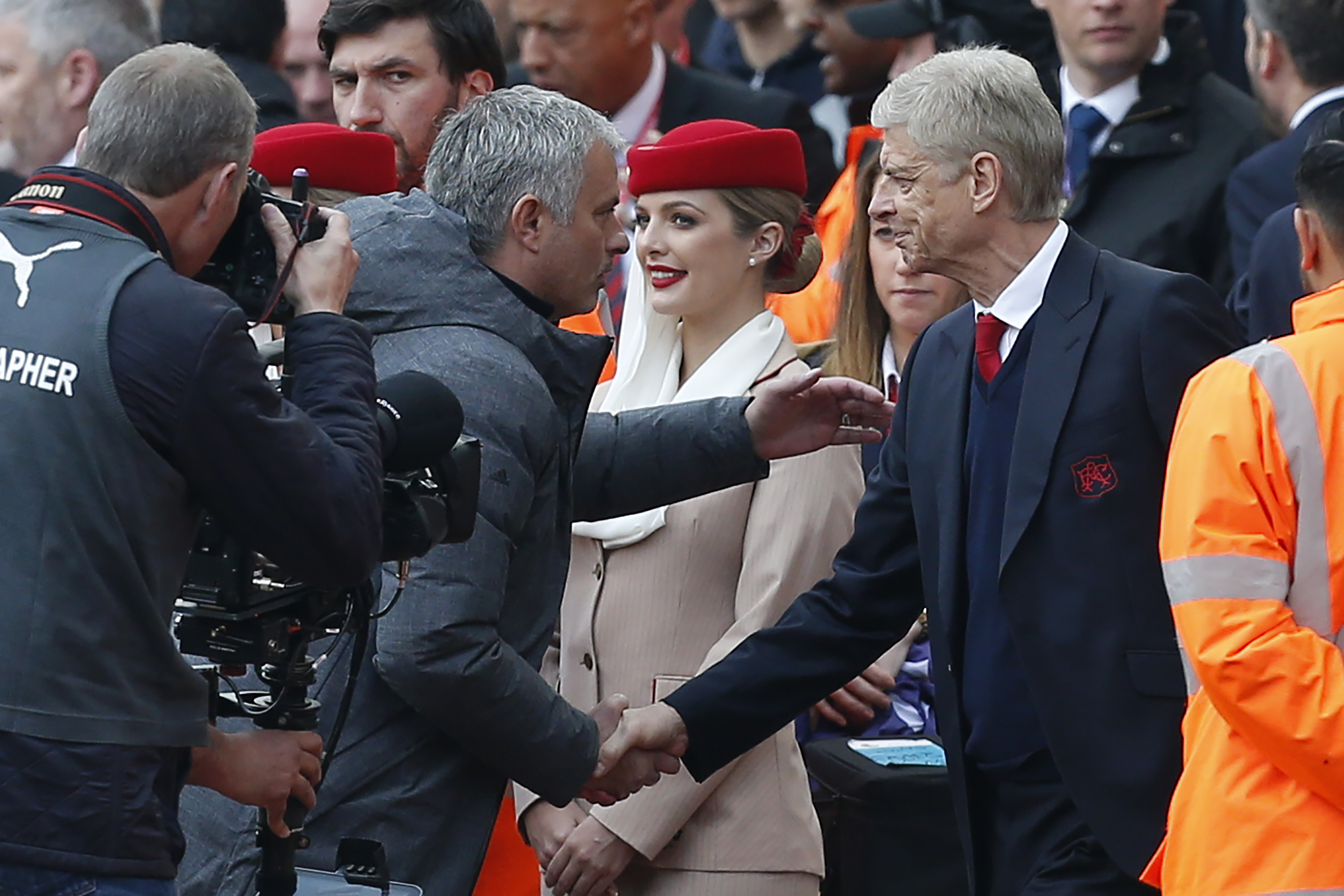 Arsenal's French manager Arsene Wenger (R) shakes hands with Manchester United's Portuguese manager Jose Mourinho ahead of the English Premier League football match between Arsenal and Manchester United at the Emirates Stadium in London on May 7, 2017.  / AFP PHOTO / IKIMAGES / Ian KINGTON / RESTRICTED TO EDITORIAL USE. No use with unauthorized audio, video, data, fixture lists, club/league logos or 'live' services. Online in-match use limited to 45 images, no video emulation. No use in betting, games or single club/league/player publications.  /         (Photo credit should read IAN KINGTON/AFP/Getty Images)