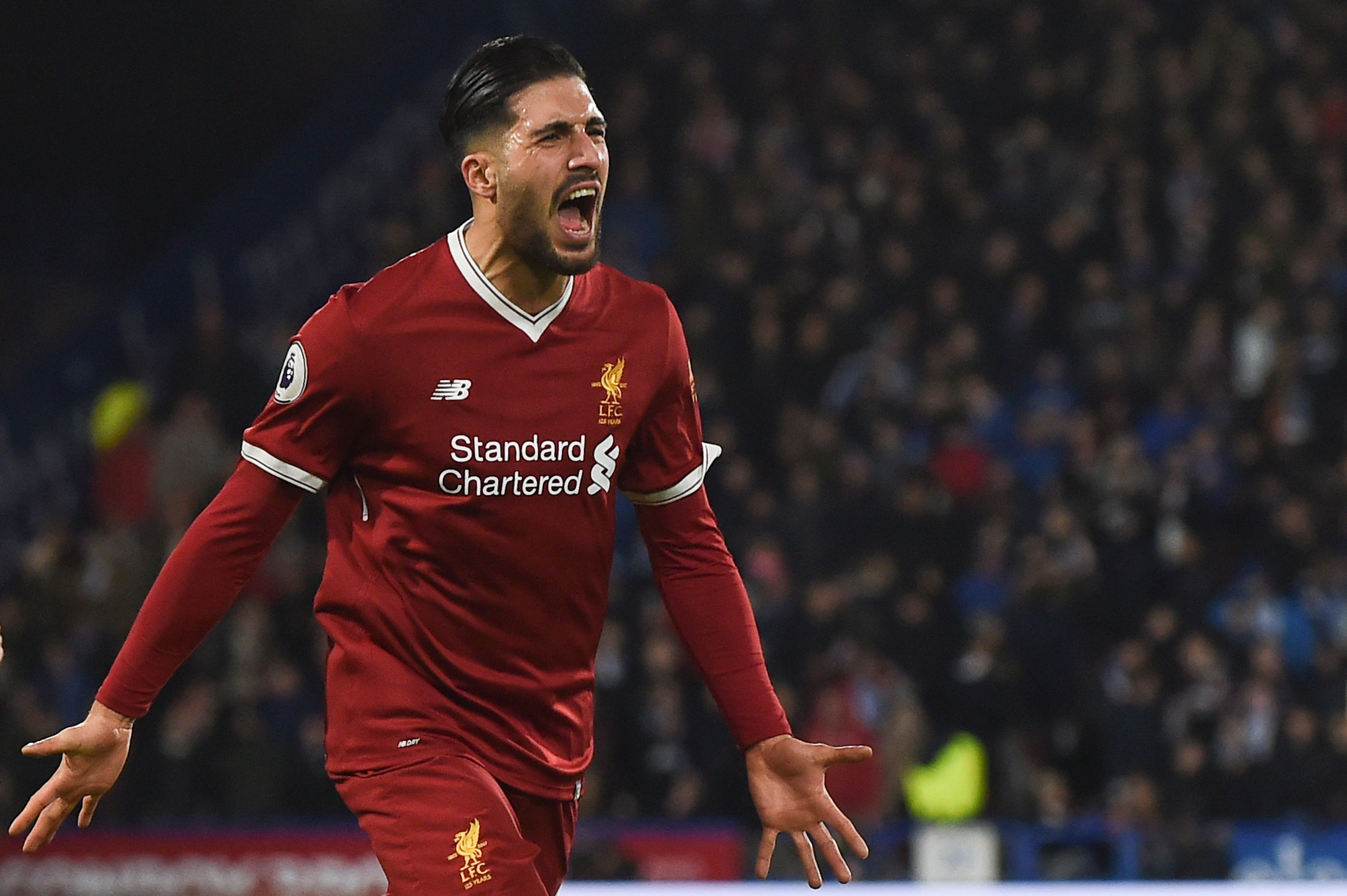 Liverpool's German midfielder Emre Can celebrates scoring the opening goal during the English Premier League football match between Huddersfield Town and Liverpool at the John Smith's stadium in Huddersfield, northern England on January 30, 2018. / AFP PHOTO / PAUL ELLIS / RESTRICTED TO EDITORIAL USE. No use with unauthorized audio, video, data, fixture lists, club/league logos or 'live' services. Online in-match use limited to 75 images, no video emulation. No use in betting, games or single club/league/player publications.  /         (Photo credit should read PAUL ELLIS/AFP/Getty Images)