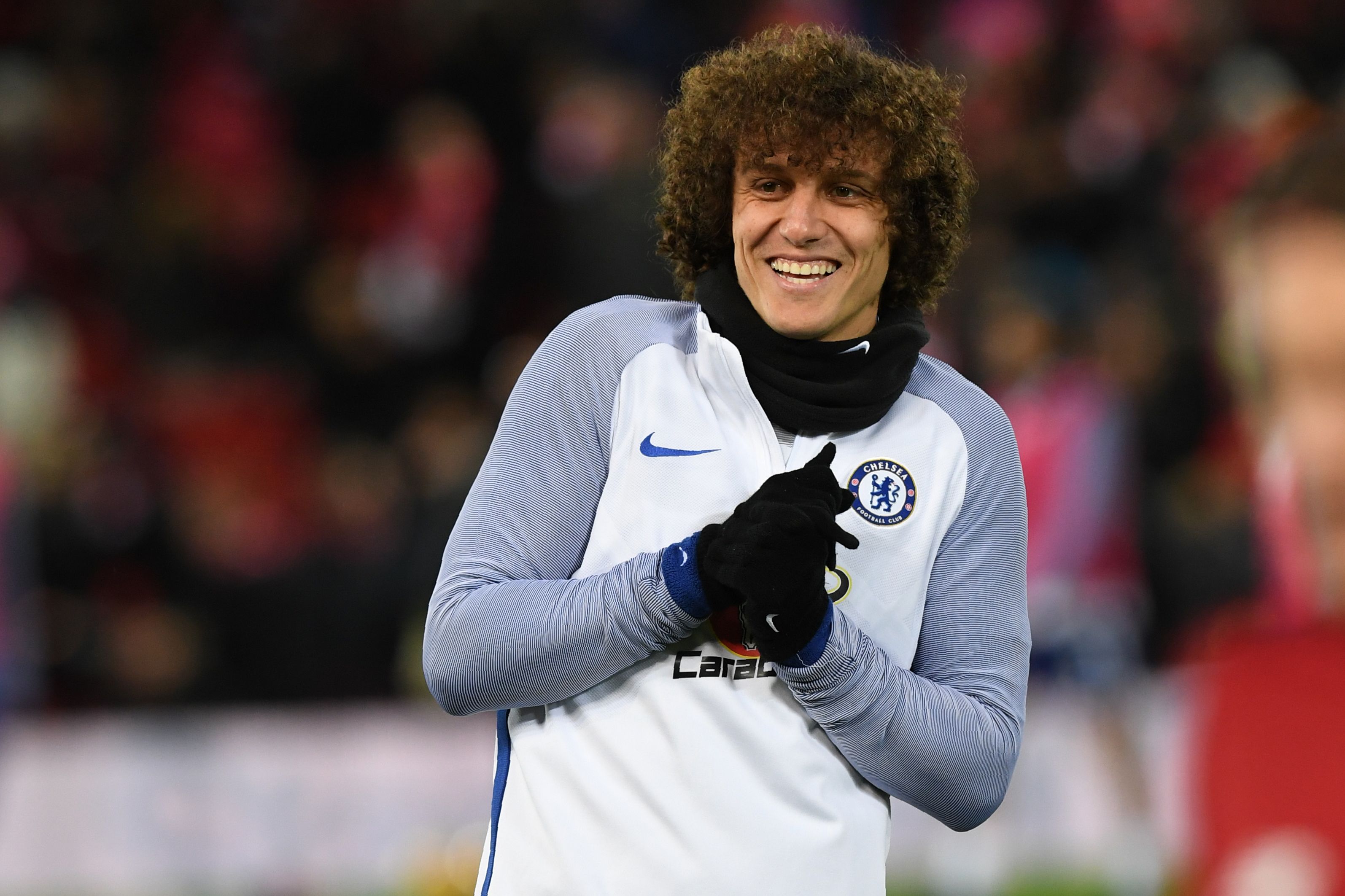 Chelsea's Brazilian defender David Luiz warms up on the pitch ahead of the English Premier League football match between Liverpool and  Chelsea at Anfield in Liverpool, north west England on November 25, 2017. / AFP PHOTO / Paul ELLIS / RESTRICTED TO EDITORIAL USE. No use with unauthorized audio, video, data, fixture lists, club/league logos or 'live' services. Online in-match use limited to 75 images, no video emulation. No use in betting, games or single club/league/player publications.  /         (Photo credit should read PAUL ELLIS/AFP/Getty Images)