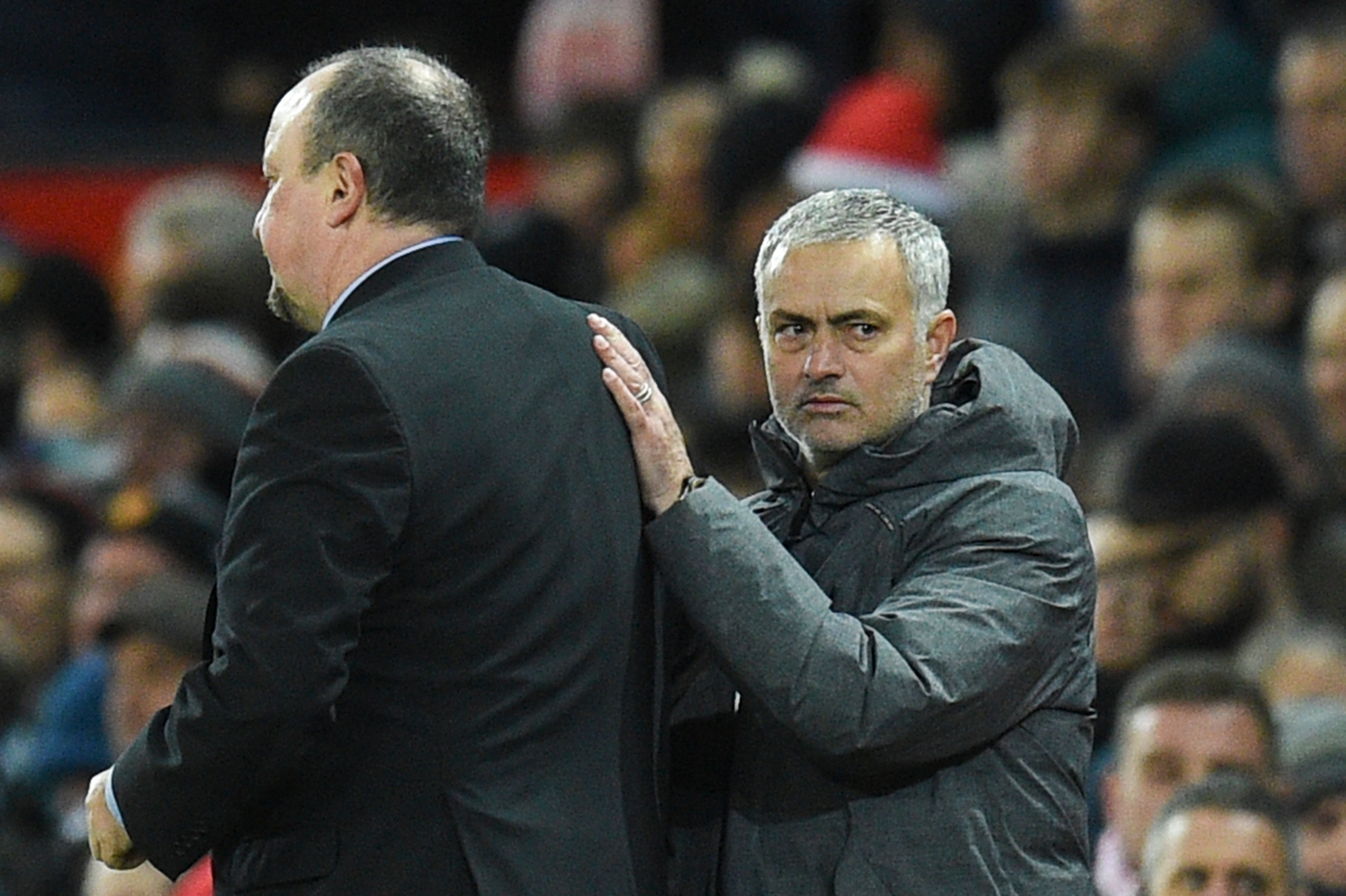 Manchester United's Portuguese manager Jose Mourinho (R) shakes hands with Newcastle United's Spanish manager Rafael Benitez (L) at the end of the English Premier League football match between Manchester United and Newcastle at Old Trafford in Manchester, north west England, on November 18, 2017. / AFP PHOTO / Oli SCARFF / RESTRICTED TO EDITORIAL USE. No use with unauthorized audio, video, data, fixture lists, club/league logos or 'live' services. Online in-match use limited to 75 images, no video emulation. No use in betting, games or single club/league/player publications.  /         (Photo credit should read OLI SCARFF/AFP/Getty Images)