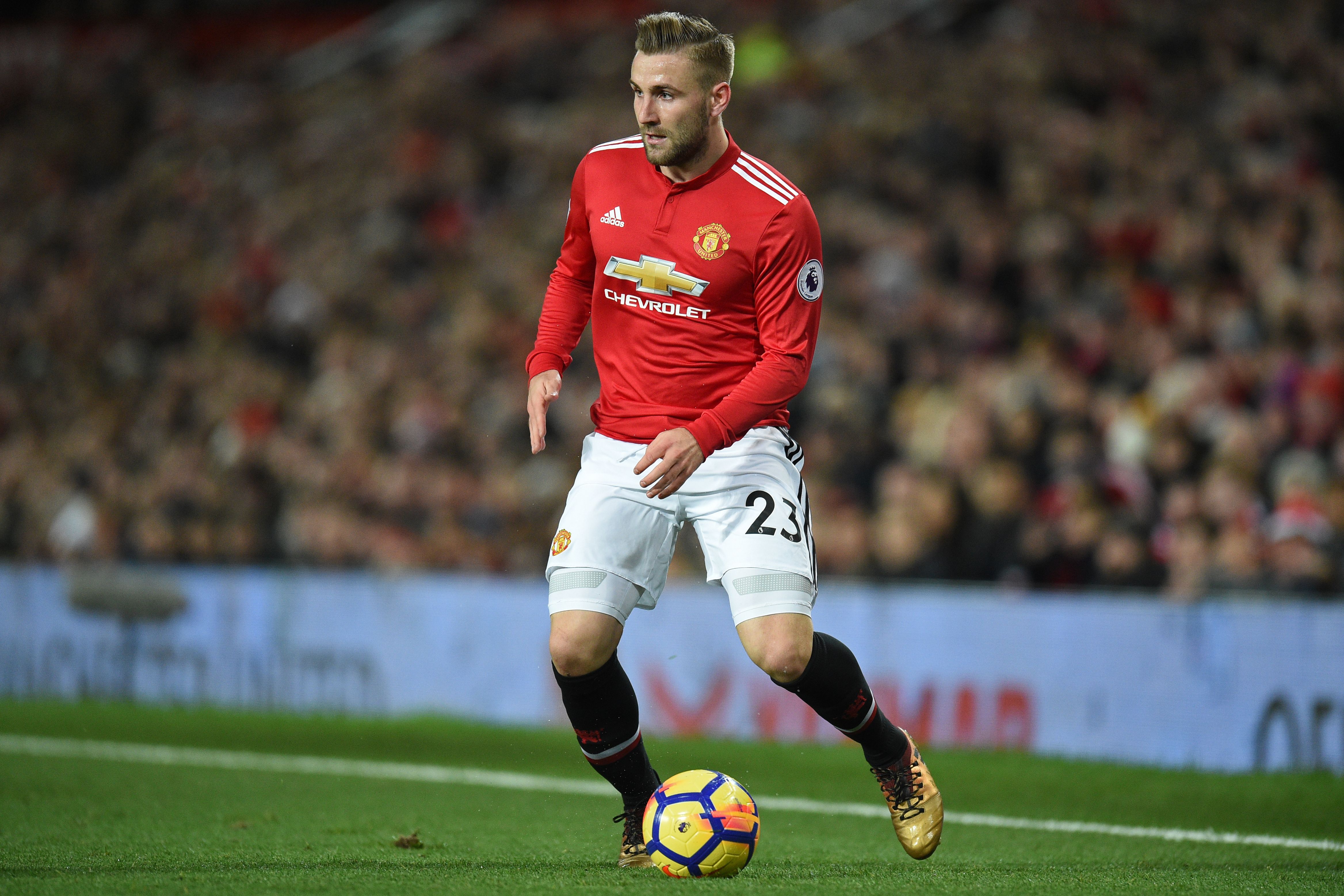 Manchester United's English defender Luke Shaw prepares to pass the ball during the English Premier League football match between Manchester United and Southampton at Old Trafford in Manchester, north west England, on December 30, 2017. / AFP PHOTO / Oli SCARFF / RESTRICTED TO EDITORIAL USE. No use with unauthorized audio, video, data, fixture lists, club/league logos or 'live' services. Online in-match use limited to 75 images, no video emulation. No use in betting, games or single club/league/player publications.  /         (Photo credit should read OLI SCARFF/AFP/Getty Images)