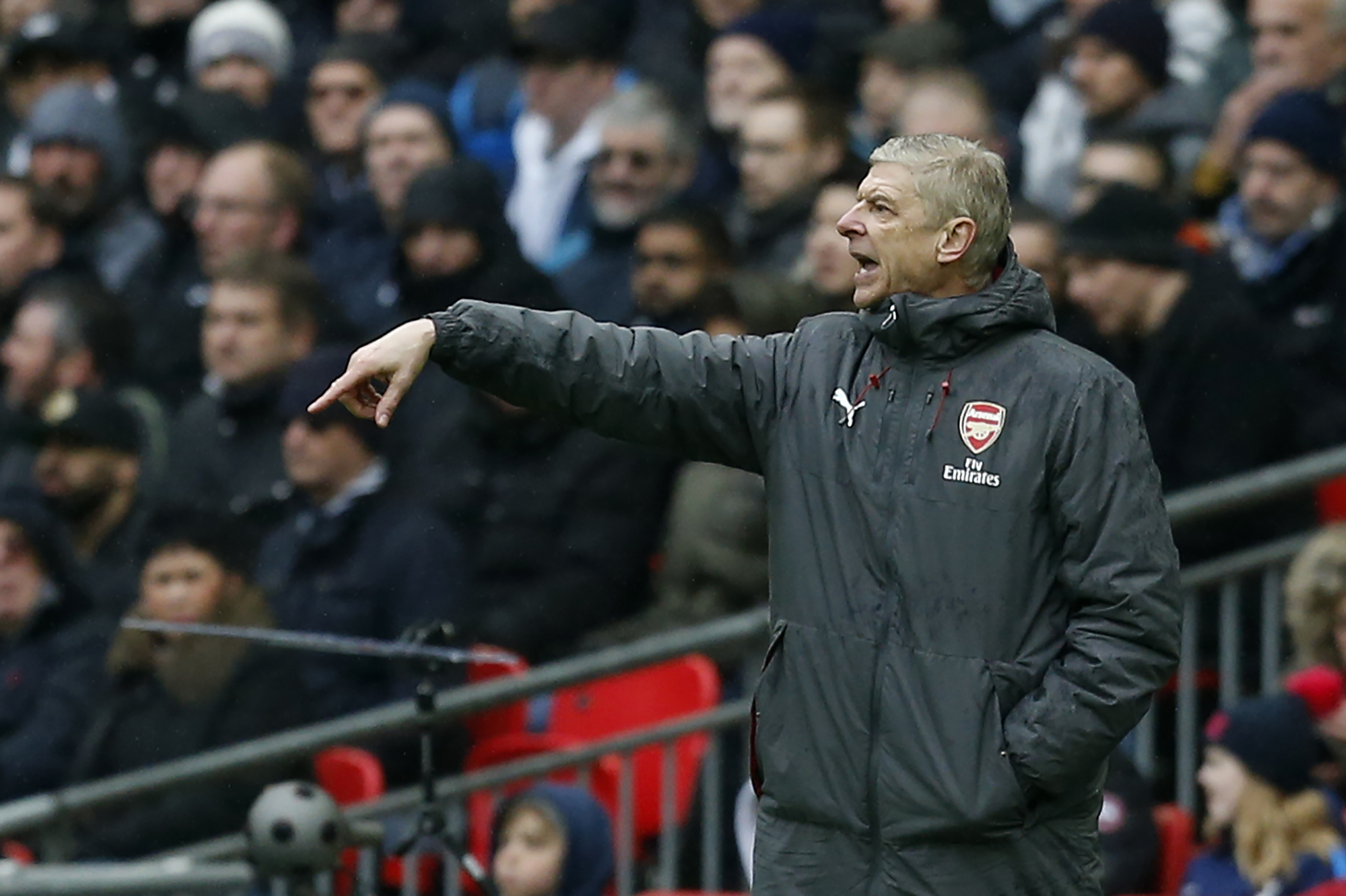 Arsenal's French manager Arsene Wenger gestures from the touchline during the English Premier League football match between Tottenham Hotspur and Arsenal at Wembley Stadium in London, on February 10, 2018. / AFP PHOTO / IKIMAGES / Ian KINGTON / RESTRICTED TO EDITORIAL USE. No use with unauthorized audio, video, data, fixture lists, club/league logos or 'live' services. Online in-match use limited to 45 images, no video emulation. No use in betting, games or single club/league/player publications.  /         (Photo credit should read IAN KINGTON/AFP/Getty Images)