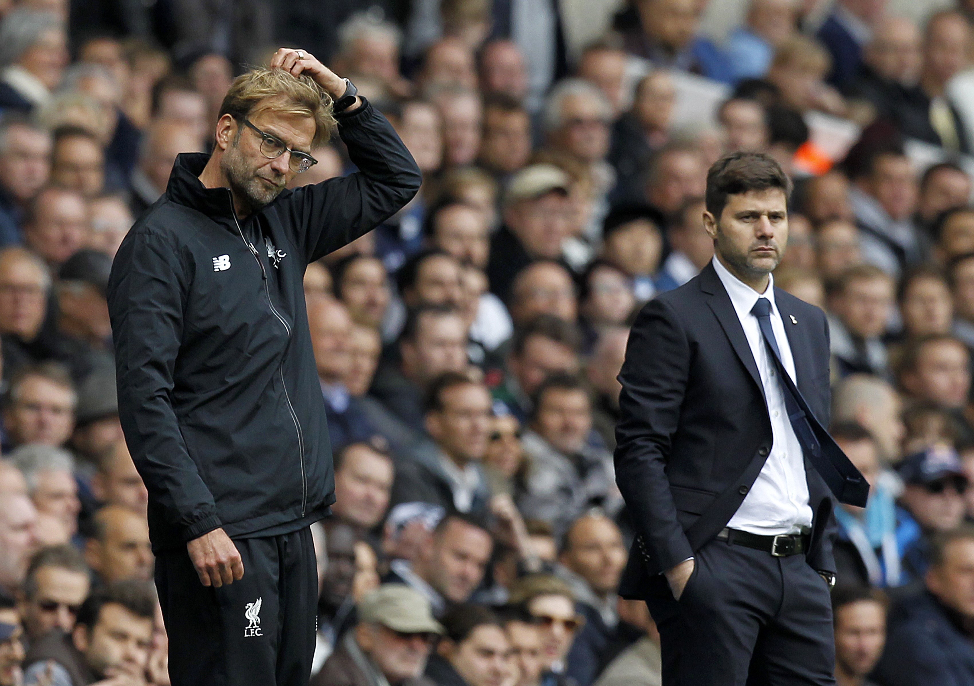 Tottenham Hotspur's Argentinian Head Coach Mauricio Pochettino (R) looks on as Liverpool's German manager Jurgen Klopp (L) gestures during the English Premier League football match between Tottenham Hotspur and Liverpool at White Hart Lane in north London on October 17, 2015. AFP PHOTO / IAN KINGTON

RESTRICTED TO EDITORIAL USE. No use with unauthorized audio, video, data, fixture lists, club/league logos or 'live' services. Online in-match use limited to 75 images, no video emulation. No use in betting, games or single club/league/player publications.        (Photo credit should read IAN KINGTON/AFP/Getty Images)