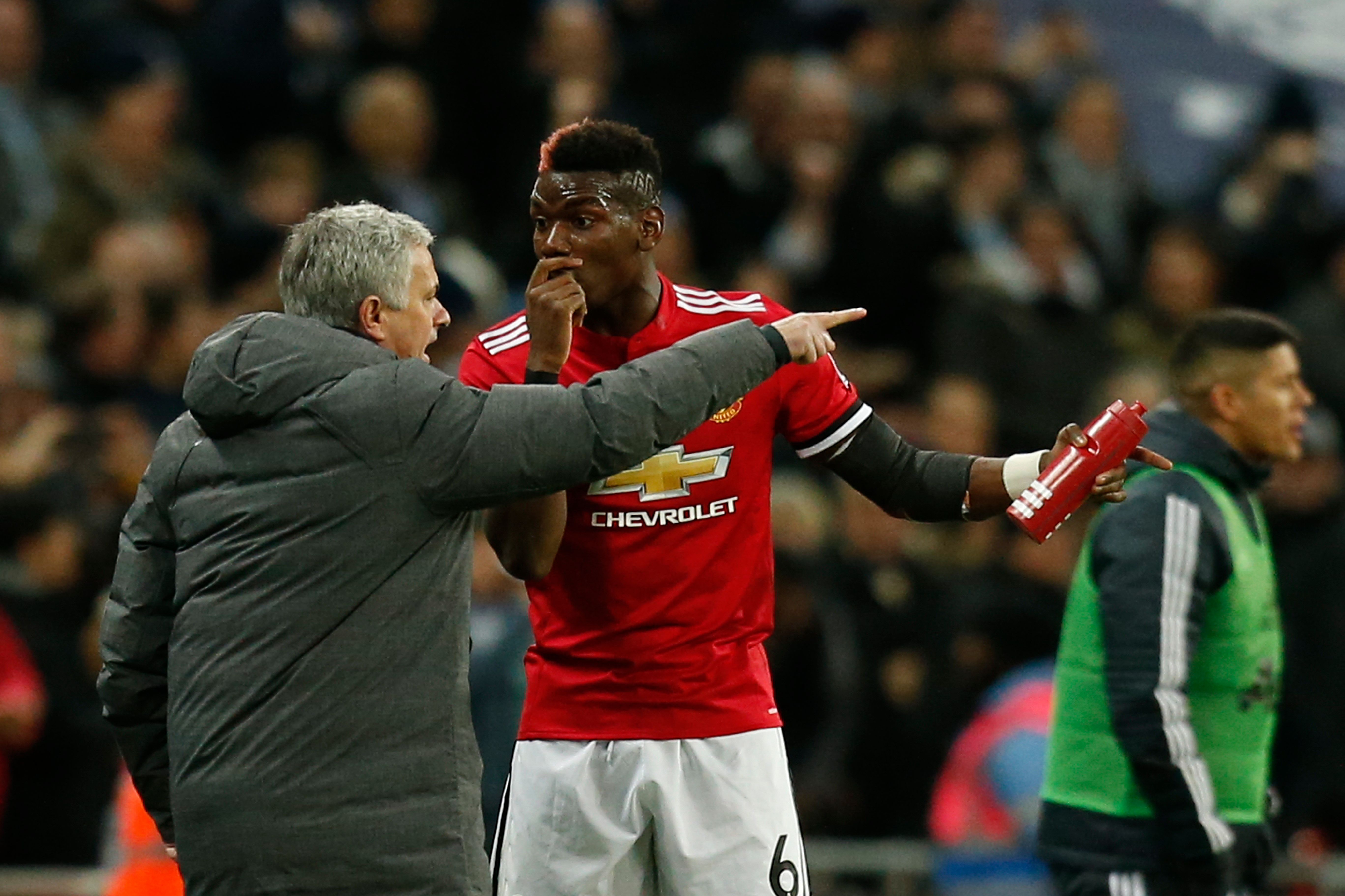 Manchester United's Portuguese manager Jose Mourinho (L) talks with Manchester United's French midfielder Paul Pogba (R) after the second Tottenham goal goes in during the English Premier League football match between Tottenham Hotspur and Manchester United at Wembley Stadium in London, on January 31, 2018. / AFP PHOTO / IKIMAGES / Ian KINGTON / RESTRICTED TO EDITORIAL USE. No use with unauthorized audio, video, data, fixture lists, club/league logos or 'live' services. Online in-match use limited to 45 images, no video emulation. No use in betting, games or single club/league/player publications.  /         (Photo credit should read IAN KINGTON/AFP/Getty Images)