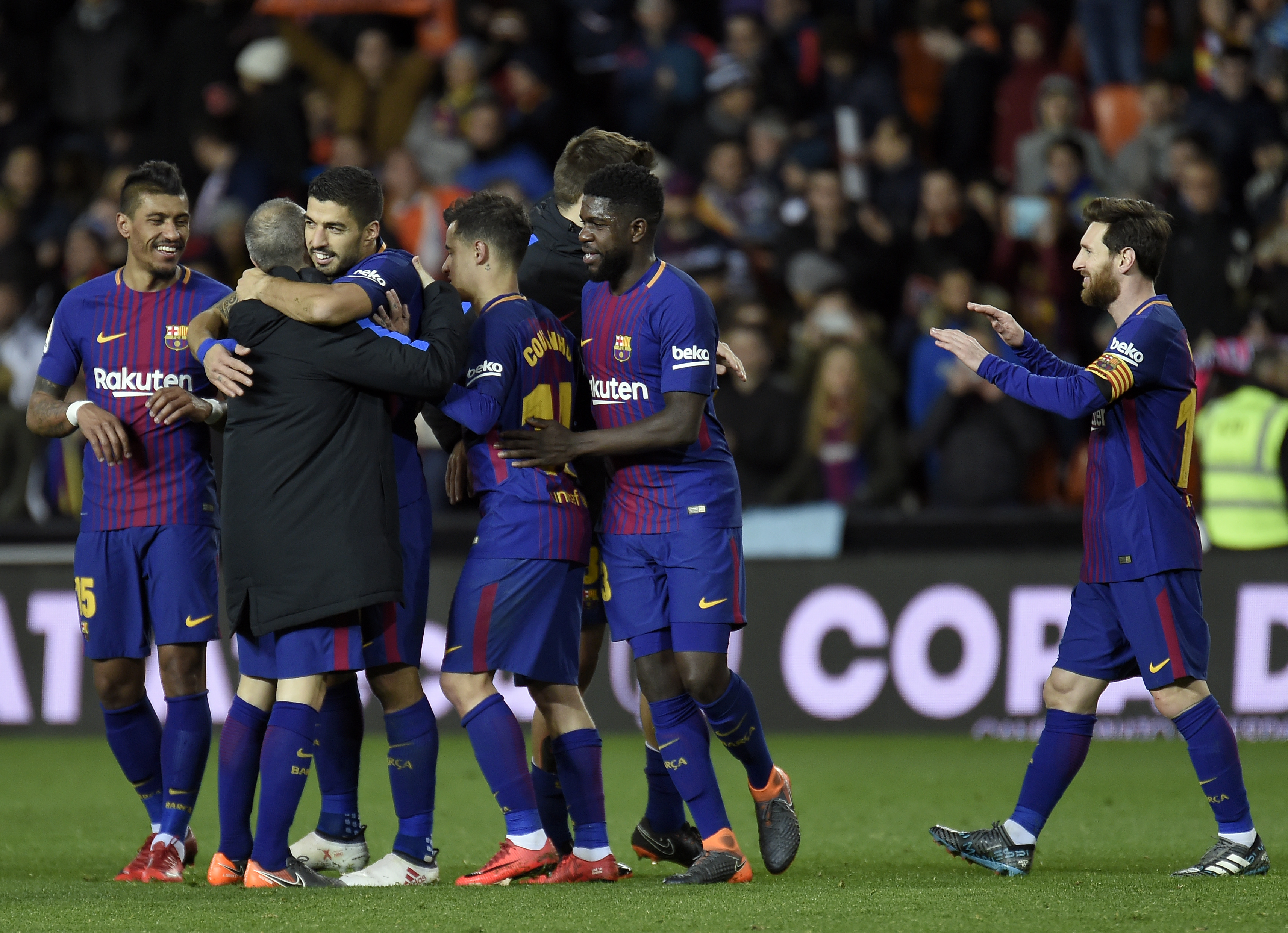 Barcelona players celebrate their qualification for the final match after the Spanish 'Copa del Rey' (King's cup) second leg semi-final football match between Valencia CF and FC Barcelona at the Mestalla stadium in Valencia on February 8, 2018. / AFP PHOTO / JOSE JORDAN        (Photo credit should read JOSE JORDAN/AFP/Getty Images)