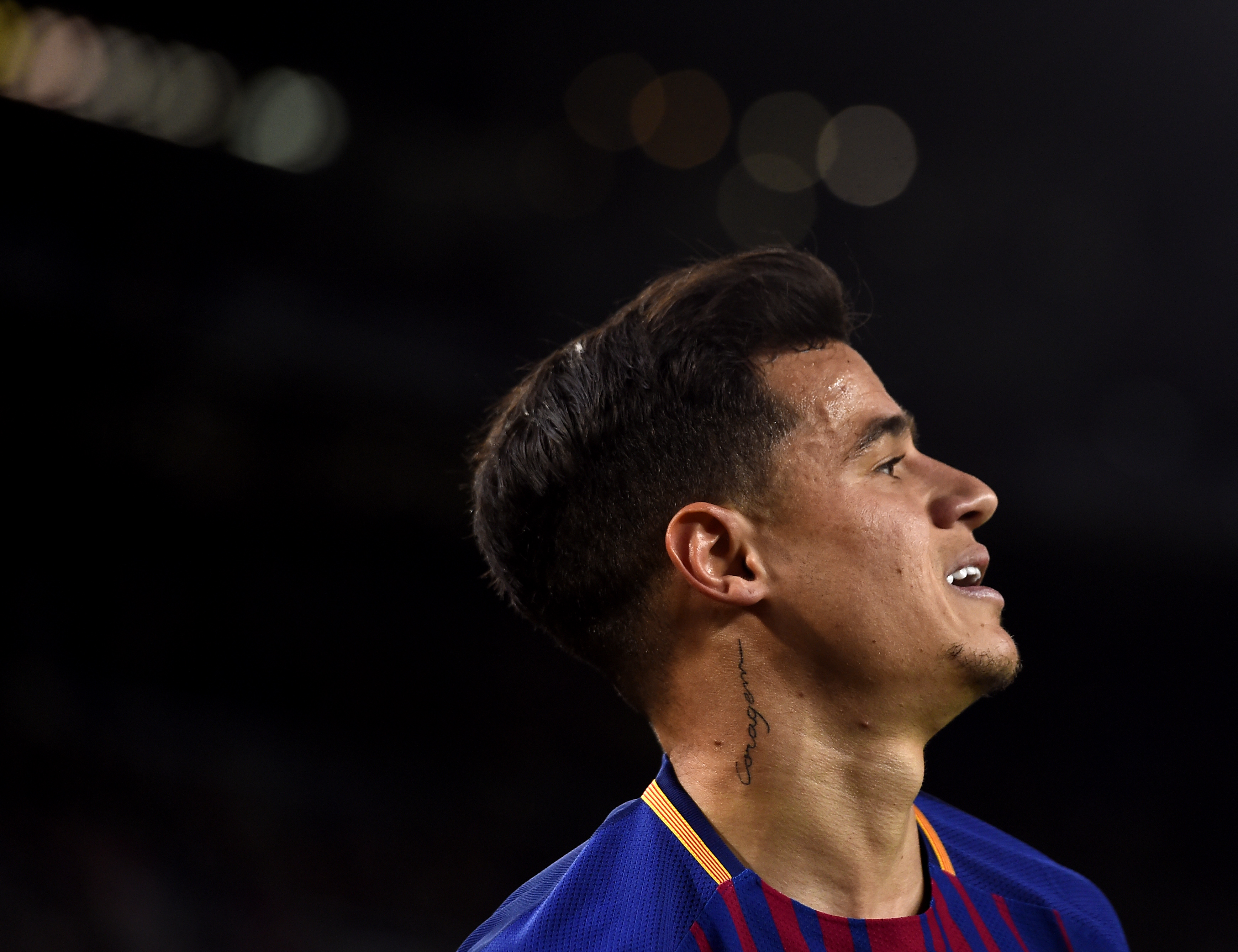 Barcelona's Brazilian midfielder Philippe Coutinho prepares for a corner kick during the Spanish league football match between FC Barcelona and Deportivo Alaves at the Camp Nou stadium in Barcelona on January 28, 2018. / AFP PHOTO / Josep LAGO        (Photo credit should read JOSEP LAGO/AFP/Getty Images)