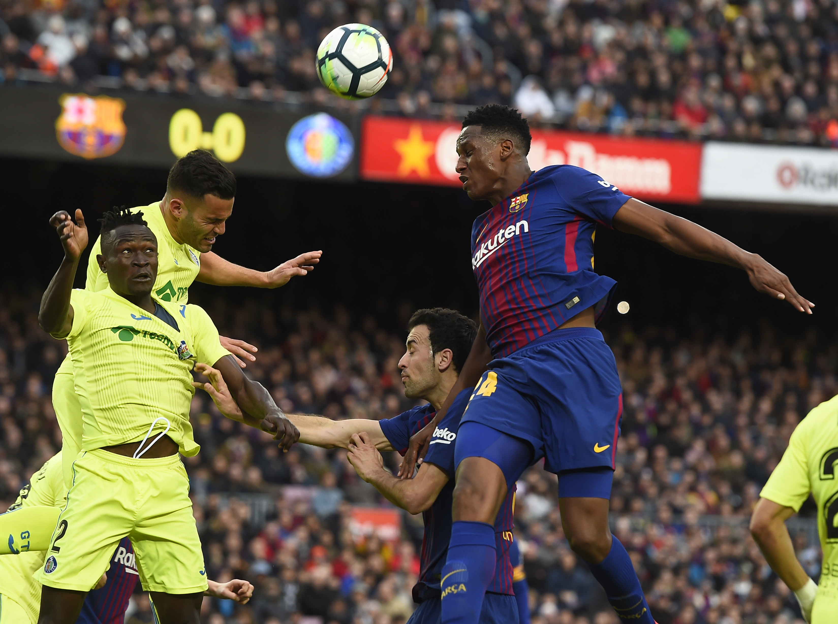 Getafe's Togolese defender Dakonam Djene (L) vies with Barcelona's Colombian defender Yerry Mina (R) during the Spanish league football match between FC Barcelona and Getafe CF at the Camp Nou stadium in Barcelona on February 11, 2018. / AFP PHOTO / Josep LAGO        (Photo credit should read JOSEP LAGO/AFP/Getty Images)