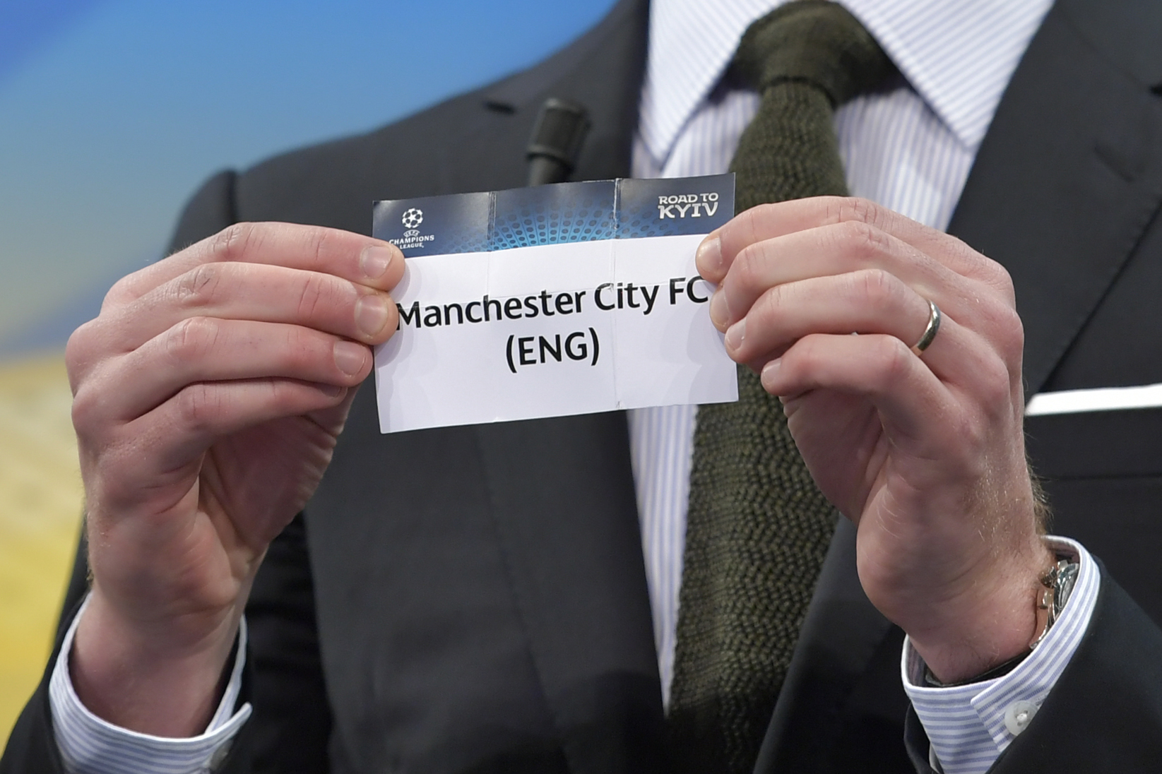 Spanish former international Xabi Alonso shows the slip of Manchester City  during the draw for the round of 16 of the UEFA Champions League football tournament at the UEFA headquarters in Nyon on December 11, 2017. / AFP PHOTO / Fabrice COFFRINI        (Photo credit should read FABRICE COFFRINI/AFP/Getty Images)