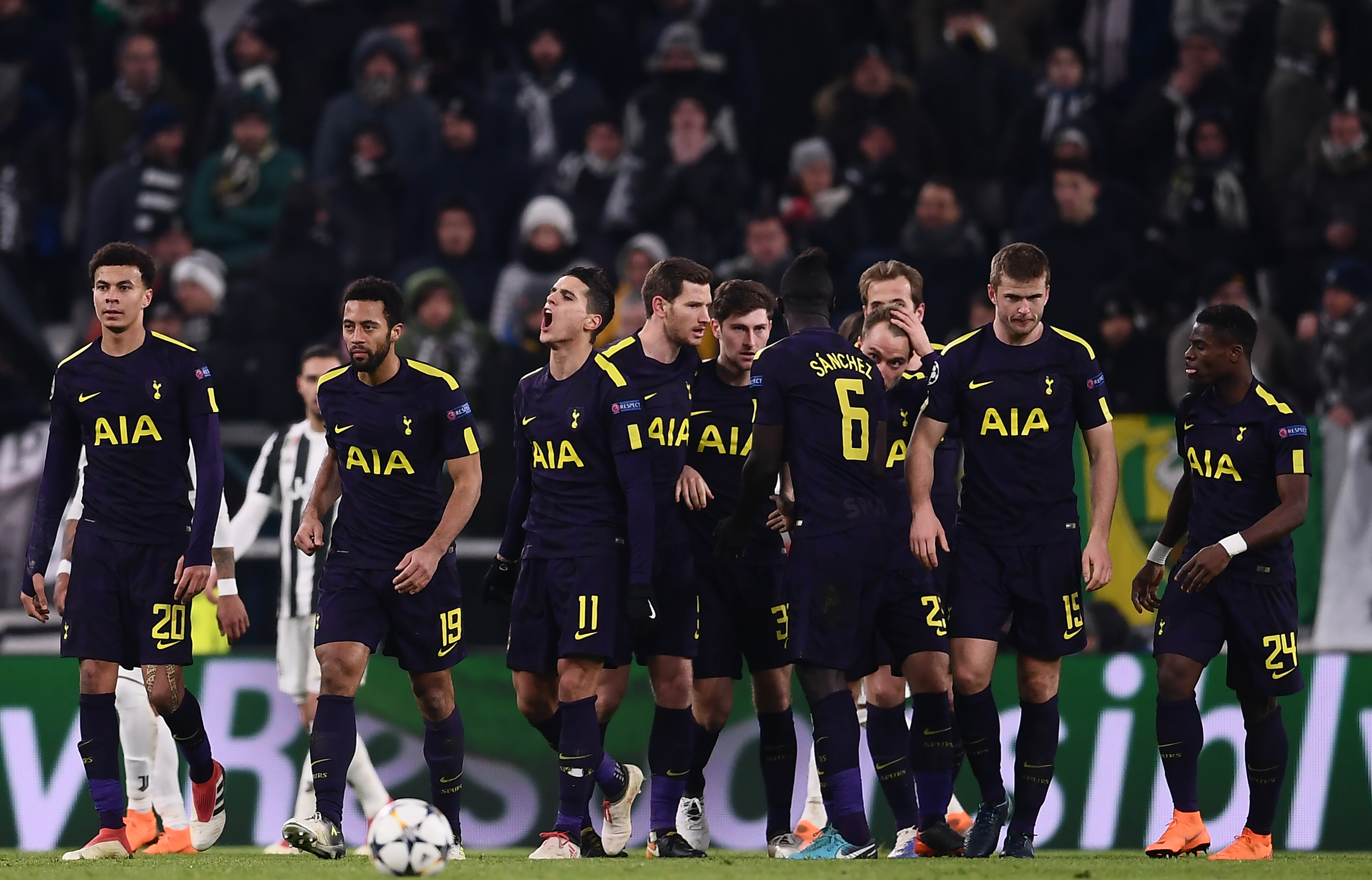 Tottenham Hotspur's Danish midfielder Christian Eriksen (4R) celebrates with teammates after scoring his team's second goal during the UEFA Champions League round of sixteen first leg football match between Juventus and Tottenham Hotspur at The Allianz Stadium in Turin on February 13, 2018.  / AFP PHOTO / Marco BERTORELLO        (Photo credit should read MARCO BERTORELLO/AFP/Getty Images)