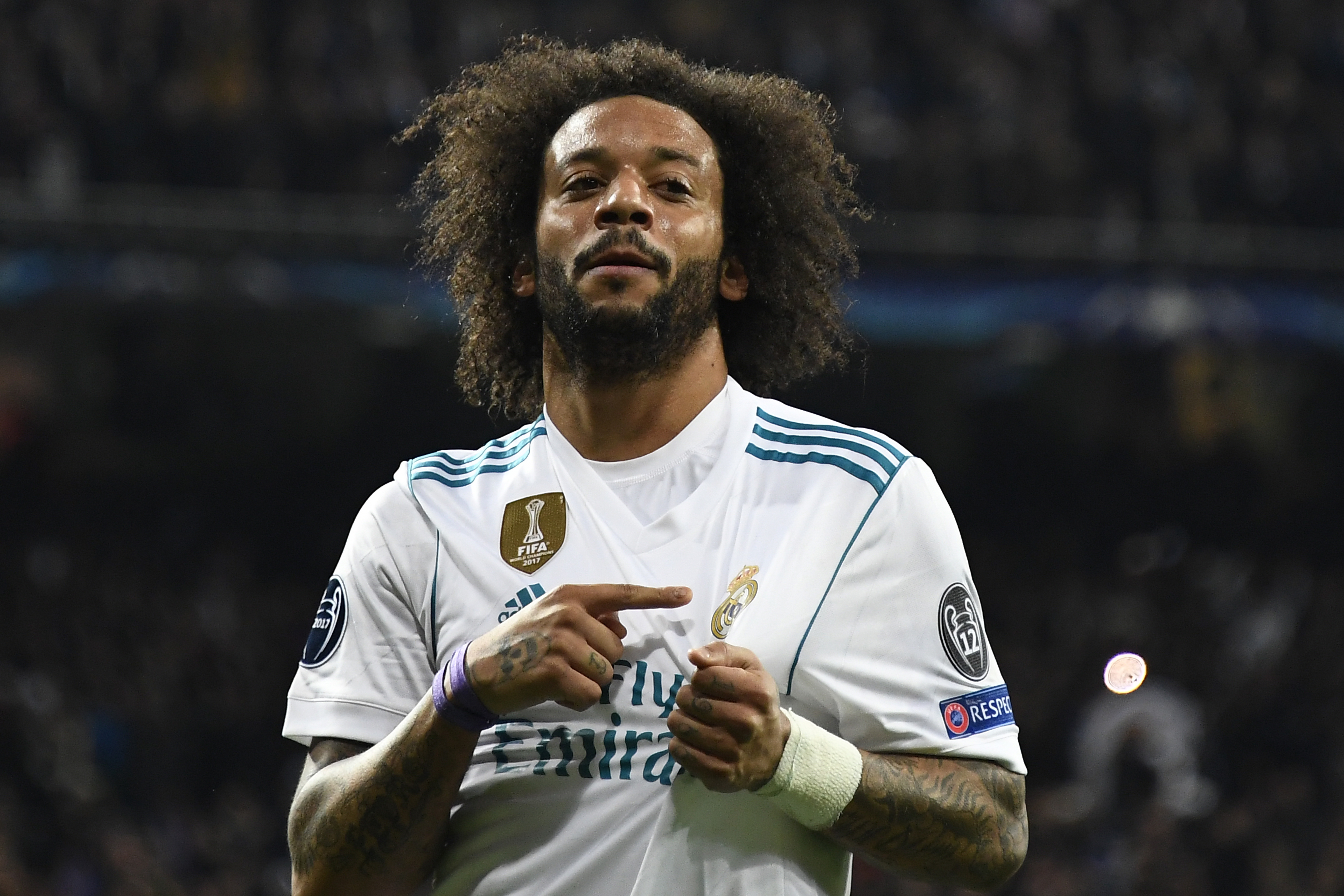 Real Madrid's Brazilian defender Marcelo celebrates  after scoring during the UEFA Champions League round of sixteen first leg football match Real Madrid CF against Paris Saint-Germain (PSG) at the Santiago Bernabeu stadium in Madrid on February 14, 2018.   / AFP PHOTO / GABRIEL BOUYS        (Photo credit should read GABRIEL BOUYS/AFP/Getty Images)