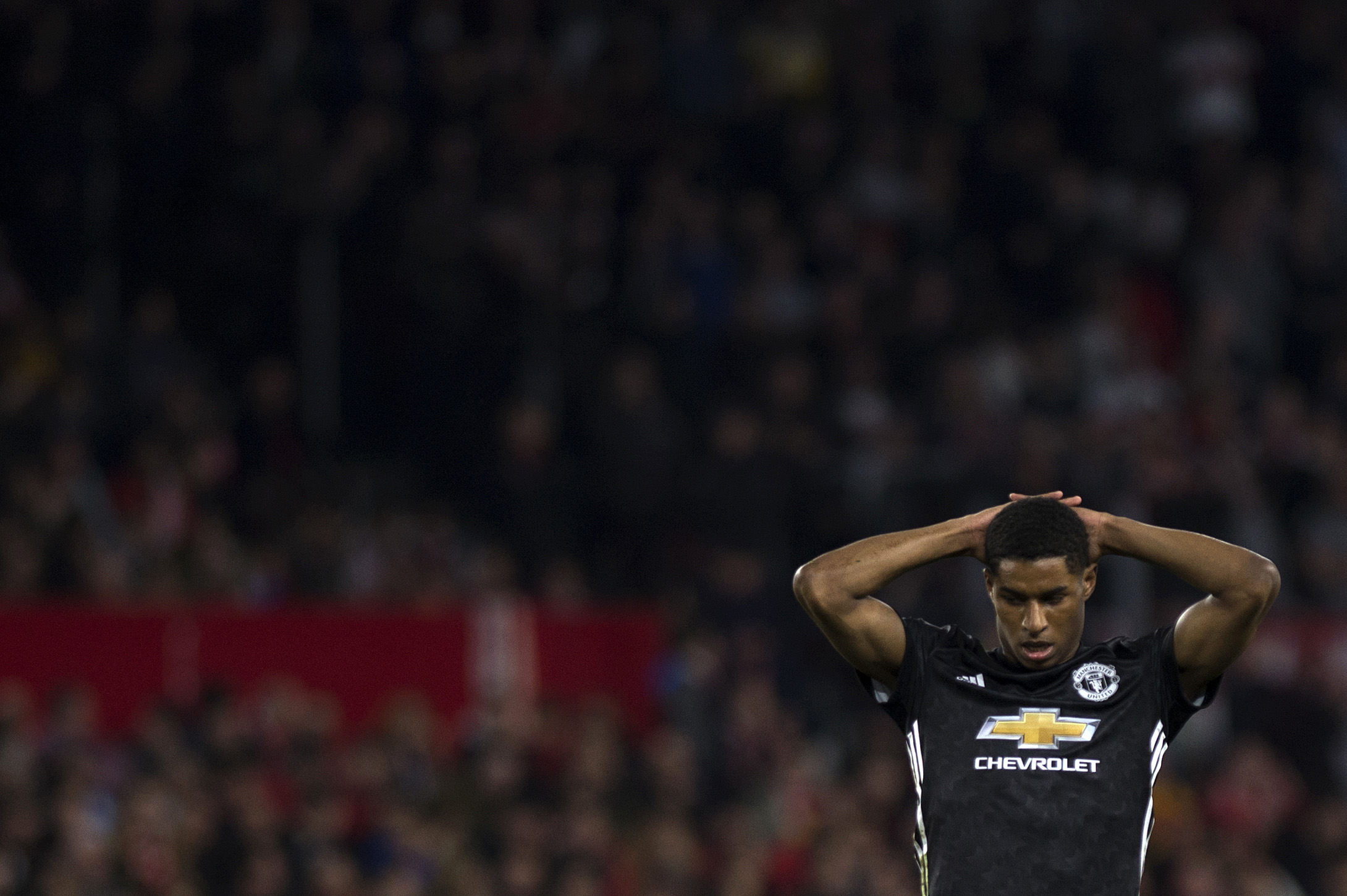 Manchester United's English striker Marcus Rashford reacts during the UEFA Champions League round of 16 first leg football match Sevilla FC against Manchester United at the Ramon Sanchez Pizjuan stadium in Sevilla on February 21, 2018. / AFP PHOTO / JORGE GUERRERO        (Photo credit should read JORGE GUERRERO/AFP/Getty Images)