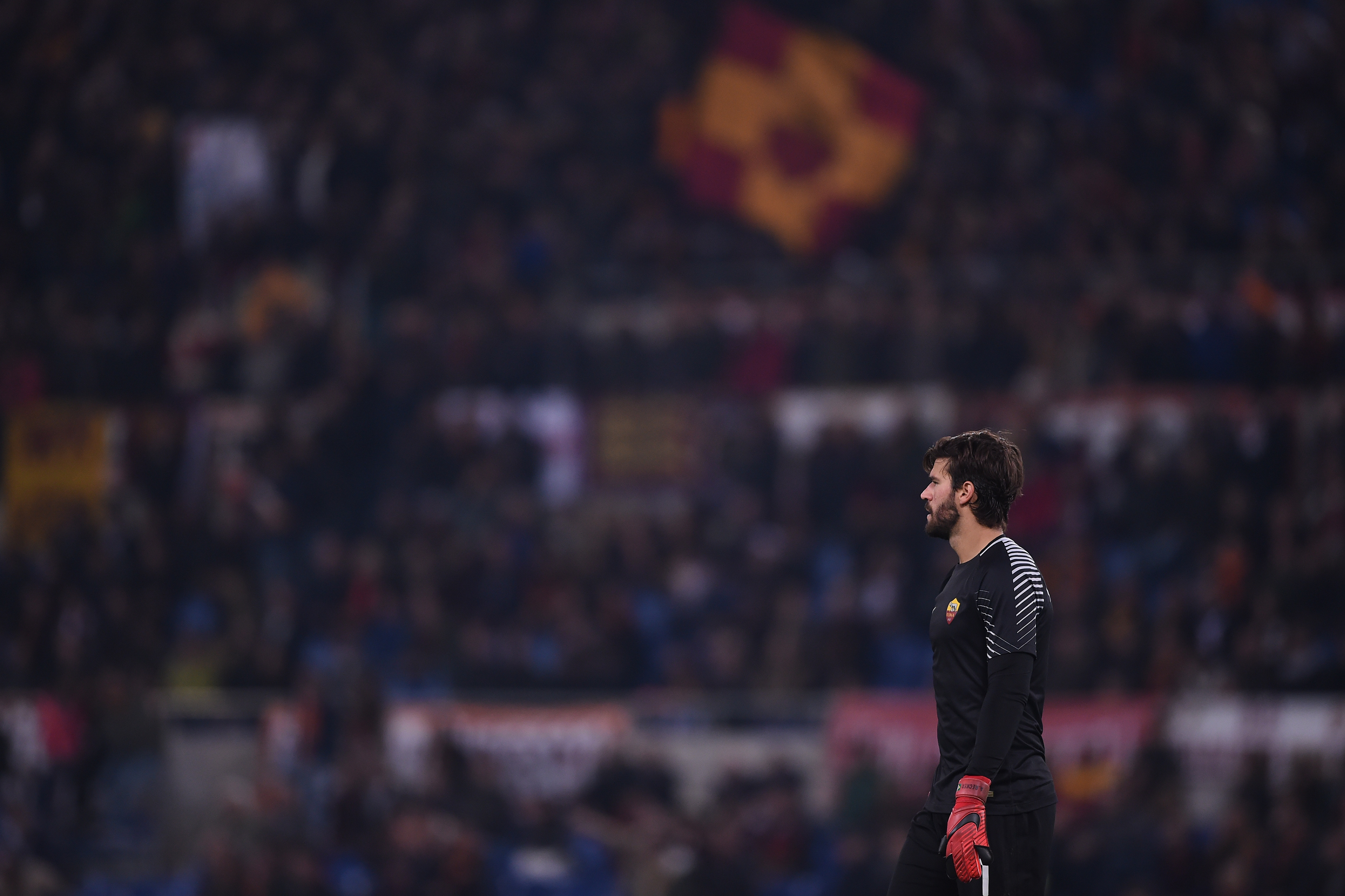 Roma's Brazilian goalkeeper Alisson looks on during the Italian Serie A football match AS Roma vs Lazio on November 18, 2017 at the Olympic stadium in Rome.  / AFP PHOTO / Filippo MONTEFORTE        (Photo credit should read FILIPPO MONTEFORTE/AFP/Getty Images)